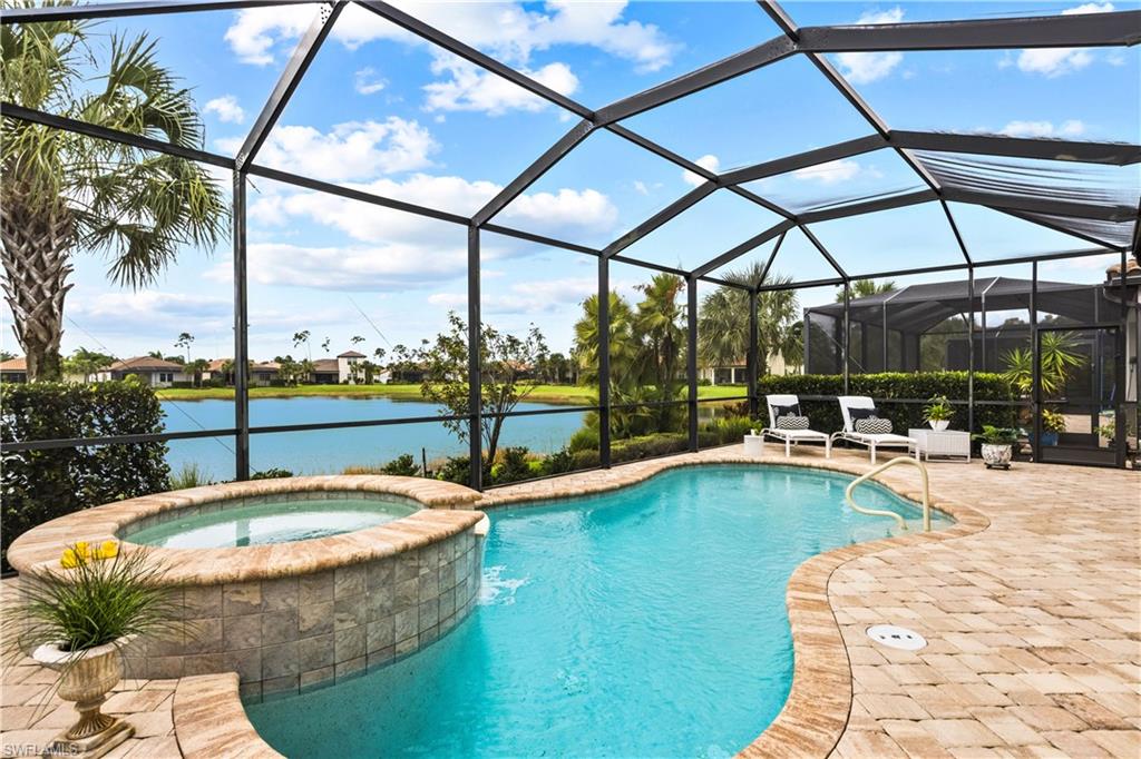Built by WCI, this impeccable Raffia Preserve Western-facing lakefront home includes a pool and spa. The property has 3 bedrooms plus a den and 2.5 bathrooms. Impressive features include hurricane-rated windows and doors, electric sunshades and new screens on the covered lanai, and granite countertops in the gourmet custom kitchen. The open-concept space makes this a great place to entertain. Located in an A-rated School District, the property is minutes away from the best dining, shopping, and beaches that Naples has to offer. Raffia Preserve is a beautiful community with a clubhouse, fitness center and resort-style pool. No CDD and very low HOA fees. See the 3d virtual tour to walk through this home.--