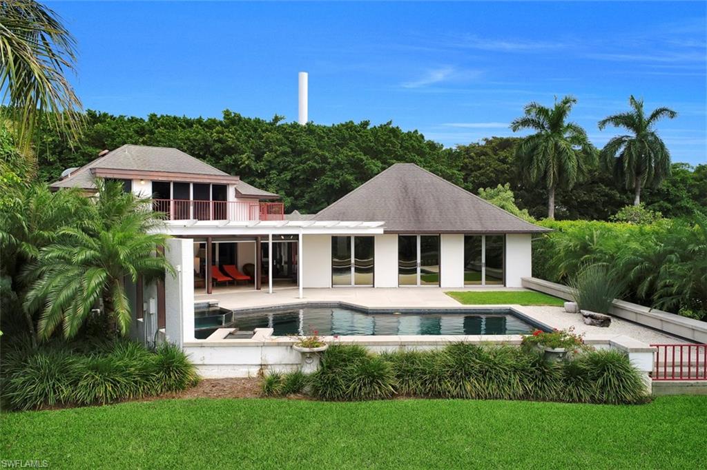 This unique Port Royal lakefront home, designed by renowned architect Kasimir Korybut, offers beautiful western exposure overlooking Half Moon Lake. Entertain friends and family on your expansive pool and patio area, with an outdoor kitchen to craft your favorite meals while taking in the sunsets. Get out and about with a visit to the Port Royal Club for some morning tennis, or a relaxing day at the beach with the sand between your toes. If you feel like staying in, bake your favorite dish in the spacious, contemporary kitchen, then cozy up in the oversized living room for your favorite movie. If you're an auto enthusiast, you will love the fully tiled, air-conditioned garage with plenty of space for your latest projects. With something for everyone, and overflowing with character, this Port Royal property is truly a must-see.