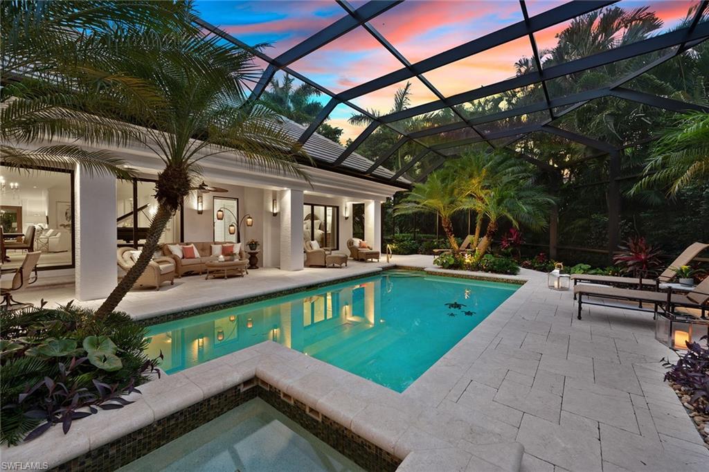 An exquisite must see residence in the desirable beach community of Pelican Bay. Situated on a lushly landscaped half-acre private lot, this four-bedroom, four-bath home featured an extensive walls-in remastering in 2003 and has since received many more current updates throughout. The home’s interior features a spacious floor plan with split bedrooms and exudes coastal elegance, along with luxury finishes and furnishings. The stunning living room features a gas fireplace accented by stone and marble, along with beautiful wood inlays on the ceiling. The inviting kitchen showcases a large island, gas range and professional-grade appliances. Off the kitchen is a casual dining and family room perfect for intimate gatherings. The expansive lanai is a tropical oasis with incredible landscaping, marble decking, sparkling pool/spa, koi pond, built-in gas grill and outdoor gas fireplace. Additional features include an oversized two-car garage, impact-resistant windows and doors and a new tile roof installed in 2020. Pelican Bay is known for its miles of immaculate beach, private beach club and restaurants, nature paths and a prime location within Naples.