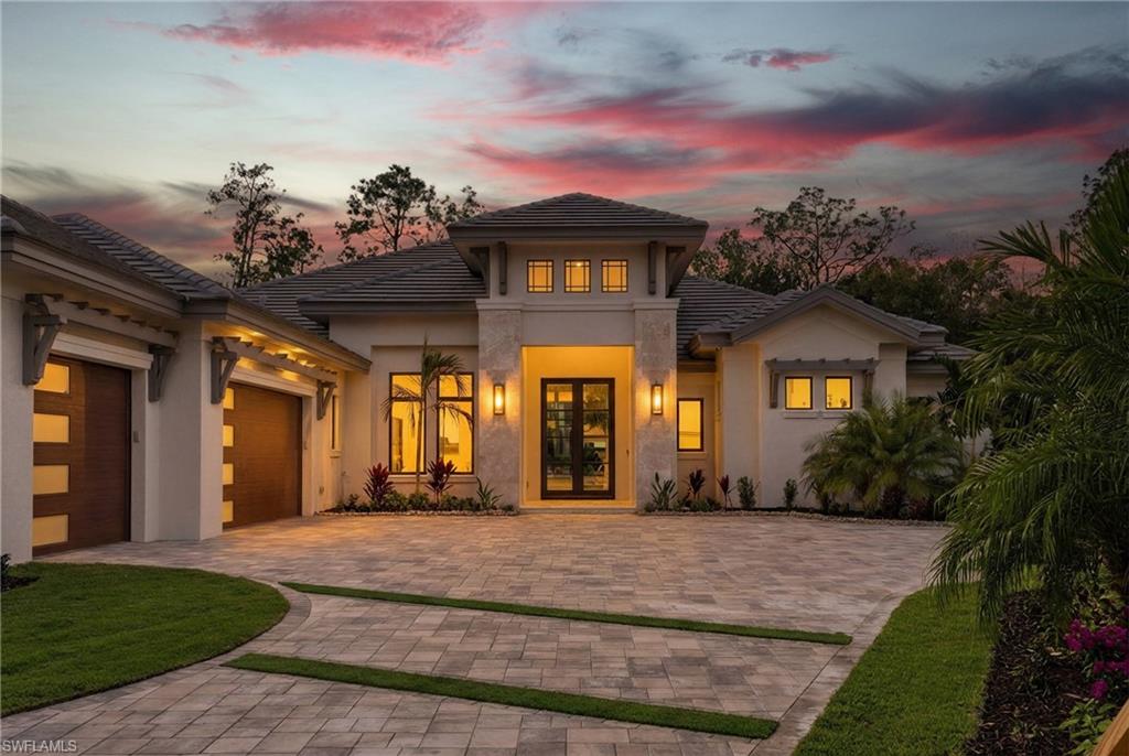 Introducing a masterpiece by Florida Lifestyle Homes in Quail West—one of Naples’ most prestigious golf course communities. This new construction residence blends timeless architecture with modern sophistication, crafted with meticulous attention to every detail. Step inside and be captivated by the expansive open floor plan, highlighted by stunning coffered ceilings with oak beams, ambient accent lighting, and elegant crown moulding. The state-of-the-art gourmet kitchen features Thermador appliances, a butler’s pantry, and designer finishes, perfect for culinary enthusiasts and entertainers alike. Each ensuite bedroom offers a private retreat with walk-in closets, while the split floor plan ensures both comfort and privacy. Additional interior highlights include wood flooring, art niches, custom moulding accents, and designer lighting throughout. The primary suite is a sanctuary of sophistication, showcasing intricate wall and ceiling treatments, dual walk-in closets, and a spa-inspired bath with two water closets, a dramatic back-lit feature wall, a soaking tub, and a luxurious pass-through shower. Transition seamlessly to the screened outdoor oasis, where expansive covered lanais with tongue-and-groove tray ceilings, recessed lighting, and a fully equipped outdoor kitchen set the stage for unforgettable gatherings. Relax by the fireplace or unwind in the designer pool and sunken spa with spillover and waterfall features. A 500-gallon buried propane tank powers the kitchen, fireplace, spa, and tankless water heater, ensuring both performance and efficiency. Perfectly situated on a wide, pie-shaped cul-de-sac lot with coveted southwest exposure, the home offers both privacy and breathtaking sunset views. Quail West residents enjoy access to two Arthur Hills-designed championship golf courses, a spectacular clubhouse with multiple dining venues, and world-class tennis and pickleball facilities. Adding to the value, this residence is offered with a Social Membership included ($100,000 value), granting you immediate access to Quail West’s vibrant lifestyle and exclusive amenities. Completion is anticipated in late November, with a full builder warranty and comprehensive buyer walk-through upon delivery. This is more than a home—it is a statement of elegance, privacy, and prestige.