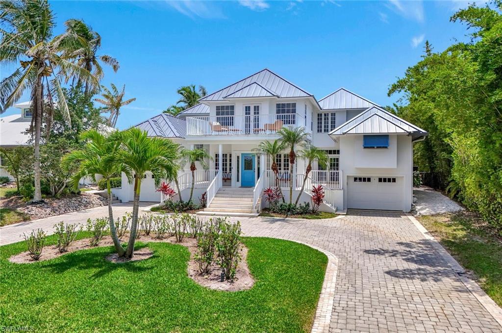 Beautifully reimagined in 2022, this coastal-inspired Royal Harbor residence combines timeless architecture, coveted southern exposure, and quick deep-water Gulf access. Designed to maximize natural light and year-round sunshine, the home offers a bright, open floor plan with 5 bedrooms, 5 full and 1 half baths, along with an abundance of flexible living and entertaining spaces. Extensive renovations include a new chef’s kitchen, designer baths, flooring, appliances, seawall, dock, and more. The heated pool and expansive outdoor living areas create a true waterfront retreat, while balconies throughout the home provide additional spaces to relax and enjoy the coastal setting. Ideally located just minutes from Old Naples, Tin City, Third Street South, and Naples’ world-renowned white-sand beaches, this exceptional property offers the perfect blend of luxury, comfort, and boating lifestyle.