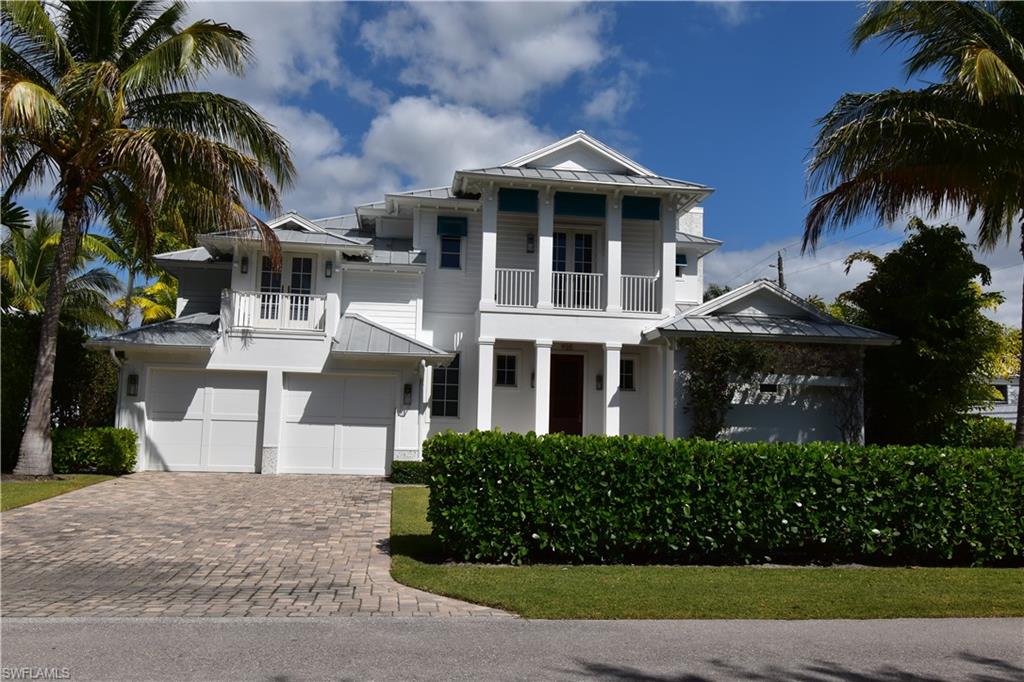 Located in the heart of Olde Naples, this 2015 RG Designed home is just steps away from beautiful Gulf beaches,  world class shopping and dining on Fifth Ave S & Third St. South.  10 Ft French doors & 3 balconies on the second floor, bathe this open floor plan coastal contemporary home with plenty of natural light.  Entertain friends & family in the bright and airy gourmet kitchen featuring Wolf Gas Range and huge white marble island.  Or take the party outside to enjoy the travertine paved lanai with heated pool with spa and outdoor pool bath. Spacious ground floor owners retreat features luxurious oversized shower w/ body jets, rain head, regular head & hand held unit, 2 vanities, 2 water closets and 2 custom walk in closets. The 2nd floor offers 3 bedrooms each with en suite bath and walk-in closets & additional bonus room. Light oak floor throughout, Anderson impact windows and doors.  500 gallon LP gas tank, Lutron LED lighting, Sonos built-in sound system, elevator ready and so much more. 7 minute walk to 3rd Street South. 9 minute walk to 5th Avenue South.  9 minute walk to Naples Beach and 14 minute walk to the famous Naples Pier.  Enjoy the Naples lifestyle at its finest.