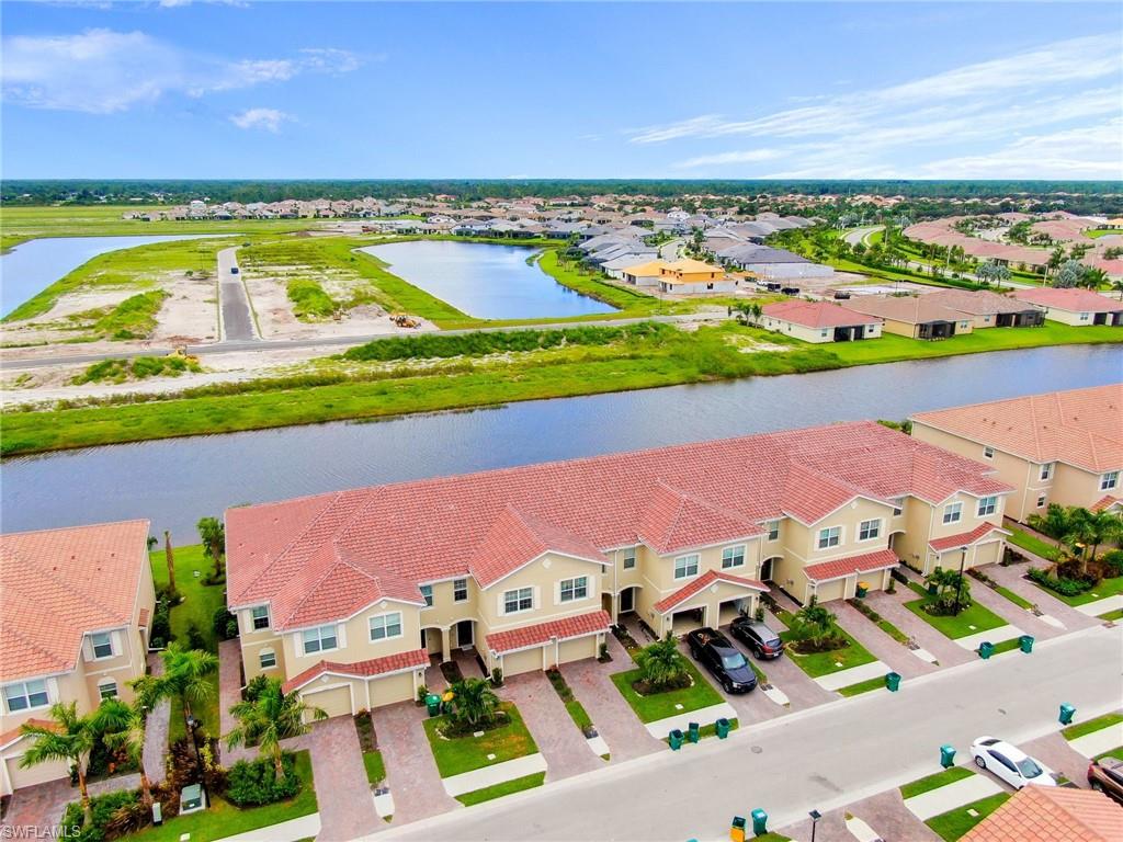 Prime Location!! Welcome to Orange Blossom Ranch Townhouses division , one of Naples Florida fastest growing  communities.  This wonderful two story townhome with expansive lake view is only 1 year old,  features nearly  1,900 Sq. Ft of living space, 3 large  Bedrooms,  2 Full  Bathrooms, 1 half bath, and 1  car garage. New kitchen, maple wood  cabinetry, new granite  countertops, new  stainless steel appliances, new light fixtures, new based boards, new crown molding, new light switches and outlets new door handles, new washer and dryer and much more. Spacious Master Bedroom, 2 large walk-in-closets, new tile flooring in all living areas and carpet in the second floor. Step out through the sliders from the great room to the screened lanai with spectacular lake views.  Orange Blossom has the most incredible lifestyle including 2 Resort Pools, 2 Spas, 2 Basketball, 2 Tennis, 2 Playgrounds, Splash Pad, Social Clubhouse, Fitness Center with Kids Play Area, Full Catering Kitchen & Bar, Sand Volleyball, Fishing Pier and more! Also desirable school district and less than 5 mins to Publix Supermarket, CVS, and the new Dunkin Donuts. New regional park being built just a few miles away!