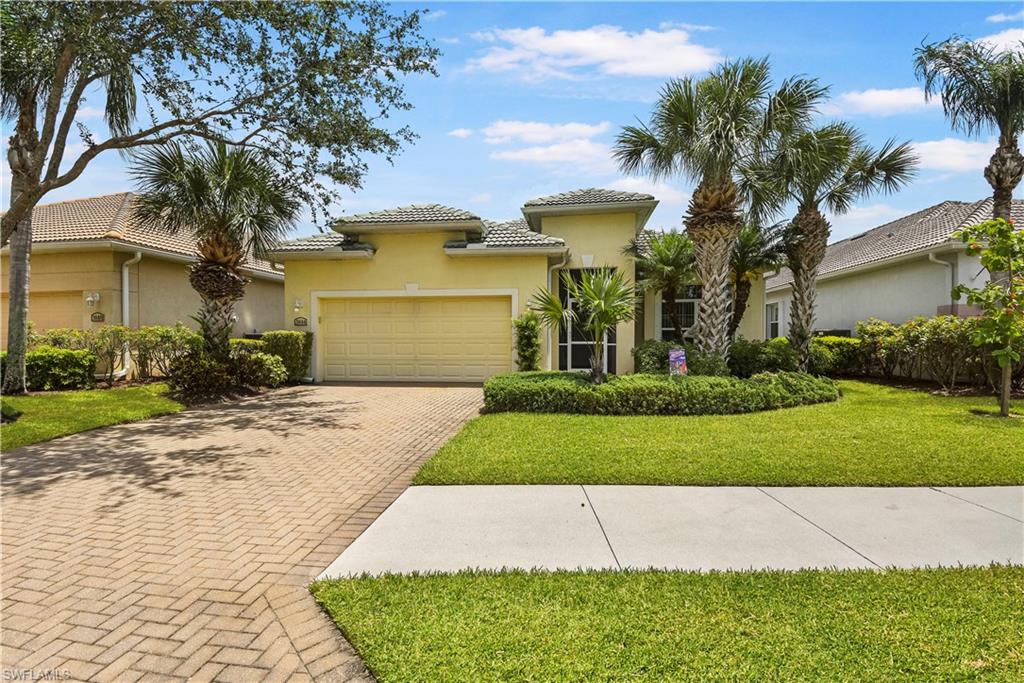 Beautiful *Pre-Inspected* lakefront home in the distinguished golf community of Cypress Woods! Offering nearly 2,300sf of living space and being sold TURNKEY, this home has everything you need to start enjoying the wonderful SW Florida lifestyle. You will love spending time on the extended rear lanai that has a peaceful & tranquil view of the lake and features a heated pool w/ accent night lighting on the perimeter, a summer kitchen, and under truss area for outdoor dining. Having a split bedroom floor plan & great room design, this home features a den/4th bedroom w/ French door entry & walk-in closet, volume ceilings, 16" tile flooring set on diagonal, tray ceilings w/ lighting, crown molding, custom mirror in formal dining area, hardwood entertainment center, custom dry bar w/ glass block & shelving, and large panel sliders that allow lots of natural lighting to flow into the home. Open concept kitchen offers GE Profile appliances w/cooktop & wall oven, tile backsplash, and a breakfast bar. Cypress Woods is a bundled golf community offering resort-style amenities including a beautiful Clubhouse, pool,  fitness center, restaurant, pickleball & much more... Home Warranty Included!