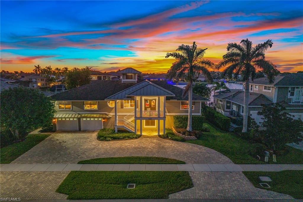 What draws people to Marco Island is our beaches, our boating access and our easy-going lifestyle. Look no further, this home has it all! On beautiful Collier Bay with 100 feet of direct access bay frontage, one mile to Tigertail Beach and stunning sunset exposure. This home is the epitome of Florida living and ideal for all buyers, seasonal or full-time residents, or those looking for potential rental income. Designed for casual waterfront living with an open floor plan and easy access to your indoor-outdoor living spaces while showcasing the incredible panoramic bay views throughout. The main living spaces are on the second floor of the home where you will find four bedrooms, and two and one half baths. Incredible outdoor living throughout with multiple terraces/porches and a large screened-in lanai with heated pool/spa, all which overlook the incredible views. What makes this home so special is the lower level, adding an additional 1,400-plus square feet with options of additional bedroom(s), den(s) and entertainment spaces. Spacious three-car garage, workshop area, abundant storage and easy access to your lanai/boat. Beautiful and expansive docking facility with two boat slips/lifts (14,000 pounds/7,000-pound lifts) and a large deck ideal for basking in the sun, taking in the salty breeze, catching fish, area wildlife viewing and more. Ideal waterfront location with quick, direct access through Collier Bay to the Marco River, Gulf of Mexico, endless sightseeing, exploring, restaurant and island hopping, and adventure. Great home for entertaining, as a family compound and/or as potential rental income opportunity. This home has tons of charm and character and has been lovingly maintained by the owner. Never rented. Impact glass doors/windows. Roof replaced (2017).