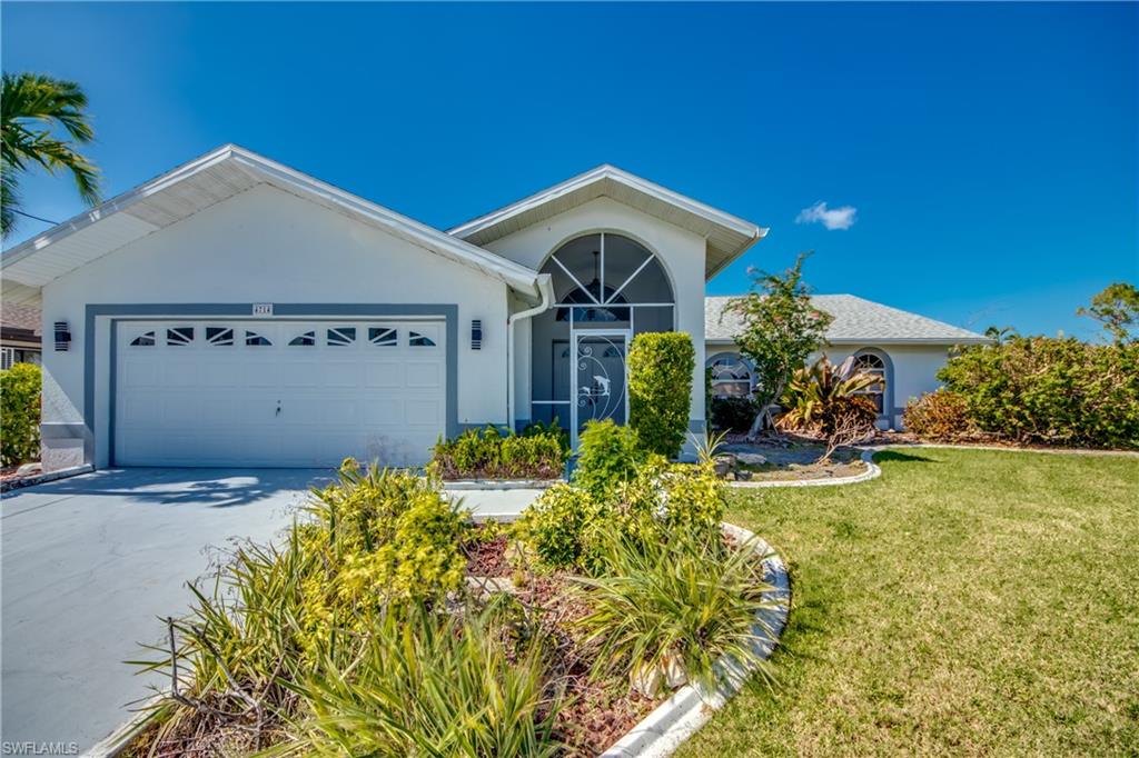 LOCATION LOCATION! Well maintained 3/2/2 home located in SW Cape Coral. Move in Ready! Easy access to Cape Coral Pkwy, shopping, dining and schools. Screened in front door area with a double door entry. Split floor plan design with tile and wood flooring. Built in cabinets by front door great for shoes, storage etc.. Granite countertops in kitchen, and stainless steel & black appliances. Plant shelves in both living & dining room. Large living area with lots of space to decorate. New mini blinds on windows. Master and guest bedroom have sliding glass doors leading to a large screened in lanai. Master bath features a large vanity with dual sinks and oversized walk-in closet. Guest bath tile & shower combo. Indoor laundry room with sink  and washer & dryer. Mature landscape with fenced in yard and plenty of room for a pool. Roof 2021 and hurricane shutters.