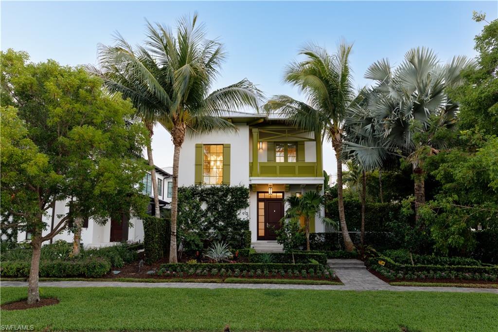 Accented with the color of morning-lit palms, this 2016 West Indies style home by Jeff Harrell and Associates offers a modern touch to the classic Naples charm. Located in the heart of Olde Naples, you’re on the doorstep of everything the city has to offer. Walking distance to 5th Avenue South and 3rd Street offers an endless variety of dining and shopping experiences. Boater? Naples Bay is a short walk away with the Naples Marina just across the street. Looking for the Beach? just head west. Find your spot in the sand with over 40 public beach access points to choose from. The home features 4 bedrooms, 4.5 baths and a 2 car garage. The open floor plan features beautiful hardwood flooring in each room, soaring ceilings, and floor-to-ceiling windows offering endless natural light.  Perched at the Western end of Jumby Bay, this home stands out with unmatched privacy and extra space. It is the only residence in the development whose pool does not back up to another home, delivering a truly secluded outdoor area. In addition, 912 sits on a larger .19-acre lot compared to the .14-acre lots of central homes, creating a generous yard beside the pool.  The chef’s kitchen is equipped with premium appliances including a Viking oven and cooktop, Miele refrigerator, Miele dishwasher, Miele convection microwave, and Uline wine cooler. A huge center island serves as the heart of the home, perfect for food preparation, casual dining, or buffet service.  The lushly landscaped lanai is accessible from the great room and kitchen through multiple French doors, offering a covered and screened seating and dining area with cabana bath, plus a gas grill in the open space. Just beyond lies the sun-drenched 32-foot pool, spacious spa, and pergola-covered seating. This is the perfect spot for relaxing or entertaining day or night. Off the pool, you’ll find a private first-floor guest bedroom. On the second floor, The oversized master suite boasts dual walk-in closets designed for maximum functionality, a floating tub, and a large separate shower. Down the hall you’ll find a guest room with an en-suite bathroom and balcony.  Above the garage and accessible from the main residence or a private alleyway entrance sits a versatile bonus space that can serve as a guest casita, office, or fitness center complete with a private bath. The HOA fee includes landscaping and pool maintenance, with weekly cleanings. On-street improvements also provide additional parking right on 9th Ave. Schedule your private showing today and make 912 9th Ave S. your new address in paradise!
