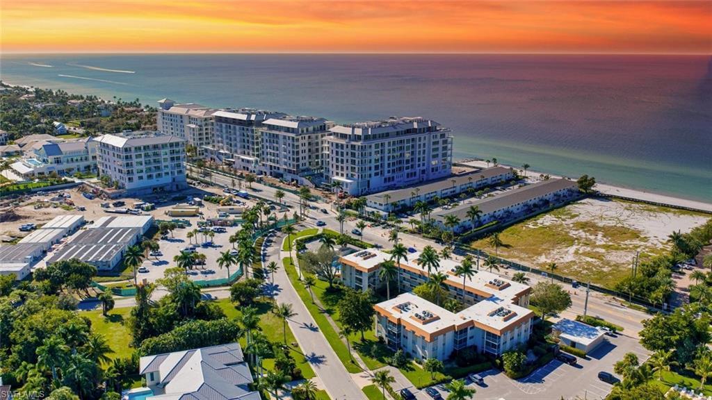 Experience the best of Naples living in this charming condominium ideally located across the street from the Gulf and moments from the new Four Seasons Resort at Naples Beach Club. Beautifully maintained and move-in ready, this two bedroom, two bathroom residence has been completely redone and includes new kitchen appliances, flooring, and bathrooms, along with a spacious living area and private screened lanai. A new AC system was installed in 2023. The Eleven Hundred Club offers an exceptional location near Fifth Avenue South and Third Street South, with community amenities including a heated pool, grilling area, bike storage, private storage, and shared laundry facilities.