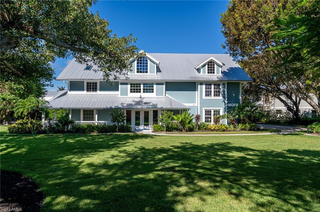 A masterpiece of design and craftsmanship awaits in this one-of-a-kind estate on Sanibel Island. Situated on over 1/2 an acre of lush, tropical landscaping framed by swaying palms, the meticulously remodeled home offers direct deep-water access from a private boat dock on a sea-walled canal, providing seamless passage to the Gulf. Every detail of this residence has been thoughtfully crafted to create a space where traditional elegance blends effortlessly with modern luxury, and each room stands out like a unique work of art. Inside, soaring ceilings and Brazilian cherry wood floors set an elegant tone, while oversized custom impact windows and sliders fill the home with natural light, showcasing breathtaking views. The great room’s custom stone fireplace serves as a focal point, adding character and warmth, while the newly renovated kitchen impresses with European appliances and custom cabinetry. Luxury extends throughout the home, including updated bathrooms and designer touches in every corner. A private elevator ensures easy access to all levels, and recent updates such as a newer roof, A/C, impact windows, and Hardi-board siding demonstrate the commitment to quality. The outdoor space is just as exceptional, with a sprawling deck overlooking the large pool and spillover spa, perfect for entertaining or unwinding in your tropical oasis. The mature trees and meticulously planned landscaping provide privacy and a serene atmosphere to soak up the Florida sun. Ample storage is available with custom closets in every room, a spacious 3-car garage, and additional storage space on the main level. Located on Sanibel Island’s desirable east end, this home offers convenience with easy access on and off the island. It’s just a short walk to the beach, marina, fine dining, and boutique shopping, all while being nestled in a tranquil setting. This estate is not just a home; it’s a work of art and a rare opportunity to experience paradise found on Sanibel Island.