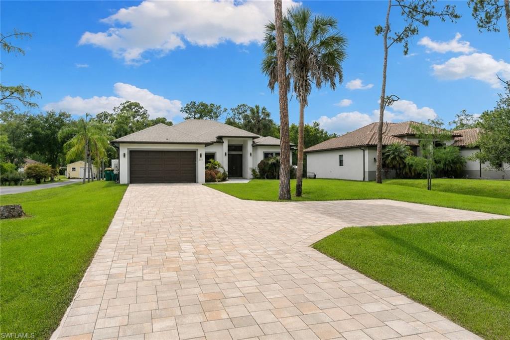 Experience the freedom and privacy that make Golden Gate Estates one of Naples' most desirable lifestyle destinations. Situated on an oversized homesite with no HOA restrictions, this beautifully maintained residence offers the perfect balance of modern comfort and wide-open space. Imagine starting your mornings with coffee overlooking your expansive yard, enjoying the peaceful sounds of nature, and ending your evenings under spectacular Southwest Florida sunsets.

Designed for both everyday living and entertaining, the home features a bright, open floor plan filled with natural light and seamless indoor-outdoor flow. The spacious property provides ample room for future additions, a pool, guest house, workshop, RV storage, boats, recreational vehicles, or simply enjoying the privacy that is increasingly difficult to find in Naples. The expansive driveway offers abundant parking for family and guests alike.

A rare and highly desirable feature, the garage is equipped with air conditioning, creating a comfortable climate-controlled space ideal for vehicle enthusiasts, a home gym, workshop, hobby room, or additional storage. This versatile area adds exceptional functionality and year-round comfort to the property.

Located just minutes from shopping, dining, schools, and everyday conveniences while still offering the tranquility of estate living, this property delivers the best of both worlds. Whether you're seeking a full-time residence, seasonal retreat, or investment opportunity, this exceptional Golden Gate Estates home invites you to embrace a lifestyle defined by space, flexibility, and the natural beauty of Southwest Florida.
