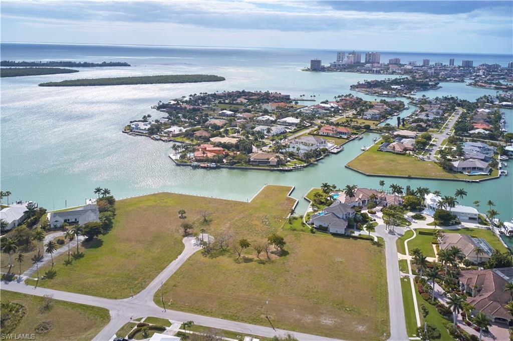 Exceptional opportunity to own a piece of paradise - create your waterfront dream home or family estate! This is 2 parcels that must be purchased together - 1771 Osceola Court (PID 58107720002) & 1781 Osceola Court (PID 58107760004). 1771 Osceola Court offers 3.04 acres and 475’ of water frontage. 1781 Osceola Court offers 1.28 acres and 130’ of waterfrontage. This is a combined total of 4.32 acres and 605' of waterfrontage. This is the largest waterfront homesite on Marco Island, and one of the largest in all of Southwest Florida. Enjoy desirable southwestern exposure and spectacular views of Caxambas Bay and the Gulf of Mexico. Fisherman and boating enthusiasts alike will delight in the almost immediate Gulf access. Ample waterfrontage will allow you to construct your own "mini marina" and fully take advantage of the gorgeous views. This is a truly unique property offering everything the discerning buyer desires. The possibilities are endless!