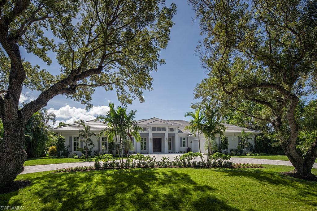 Exciting new construction opportunity with southern exposure, thoughtfully positioned on a large lot located on one of the most desirable tree-canopied streets in Coquina Sands. The residence, all situated on one level, with four bedrooms plus a den, was inspirationally conceived to address the needs of today’s buyer. From within the home, the eye is able to focus on the lushly landscaped grounds through expansive windows and sliding glass doors, creating a sense of privacy and tranquility. Particular attention was paid to great room spaces with abundant light emphasizing indoor-outdoor living and entertaining. The kitchen is comprehensively equipped and serves the casual dining area, expansive covered outdoor living area and adjacent great room with ease. Four garage spaces. Located in Coquina Sands and close to the beaches of Naples and Lowdermilk Park.