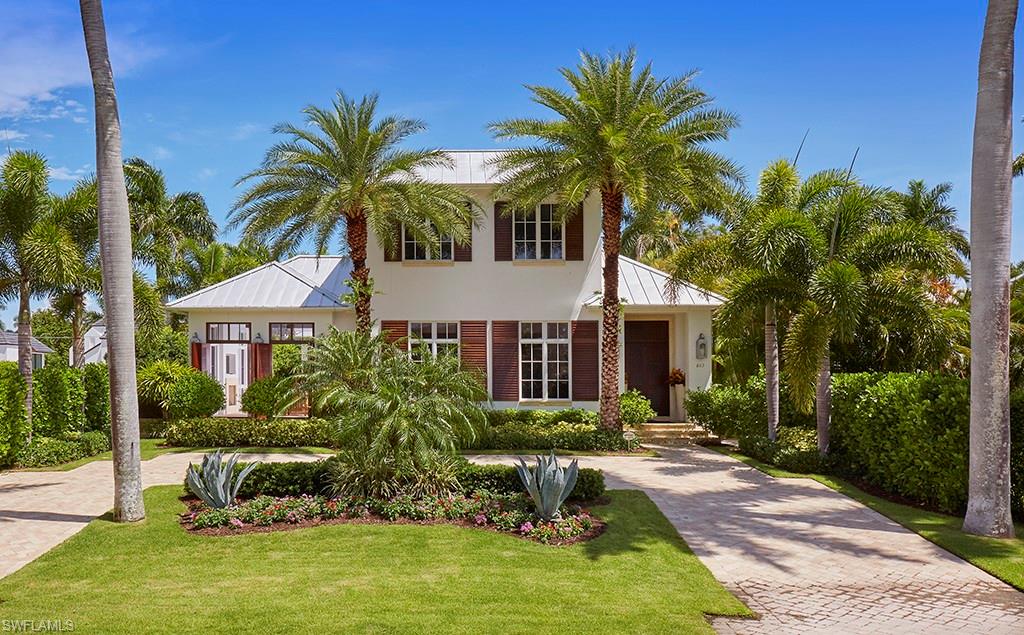 The charm of this Falconer Jones designed Olde Naples home is the classic West Indies style enhanced with 21st century luxury! At just under 4,800 s.f., this home is an oasis of comfort, infused with exotic influences.  The open and inviting floor plan begins on French white oak wide-plank flooring by Legno Bastone. A streamlined kitchen was designed for entertaining and features Miele appliances, two marble-topped islands, a full size wine refrigeration, gas cooktop, a separate "butler's kitchen", and a summer kitchen. A spacious living room - plus cozy poolside lanai - comfy study, and full dining room add to this deceivingly large home. An airy first floor Master, and three en suite bedrooms above provide ample room for family and guests. Mahogany doors and shutters, electric roll down screens and shutters surround the outdoor living spaces.  An Elan G total home automation system keeps the home alive perennially. The best in Naples living - A retreat in Paradise. And then... all of Naples' natural resources are just steps away.  Finish the day strolling to enjoy all on 3rd St. S. or 5th Ave. S. This is a home for the entire family! A nearby marina has slips available.