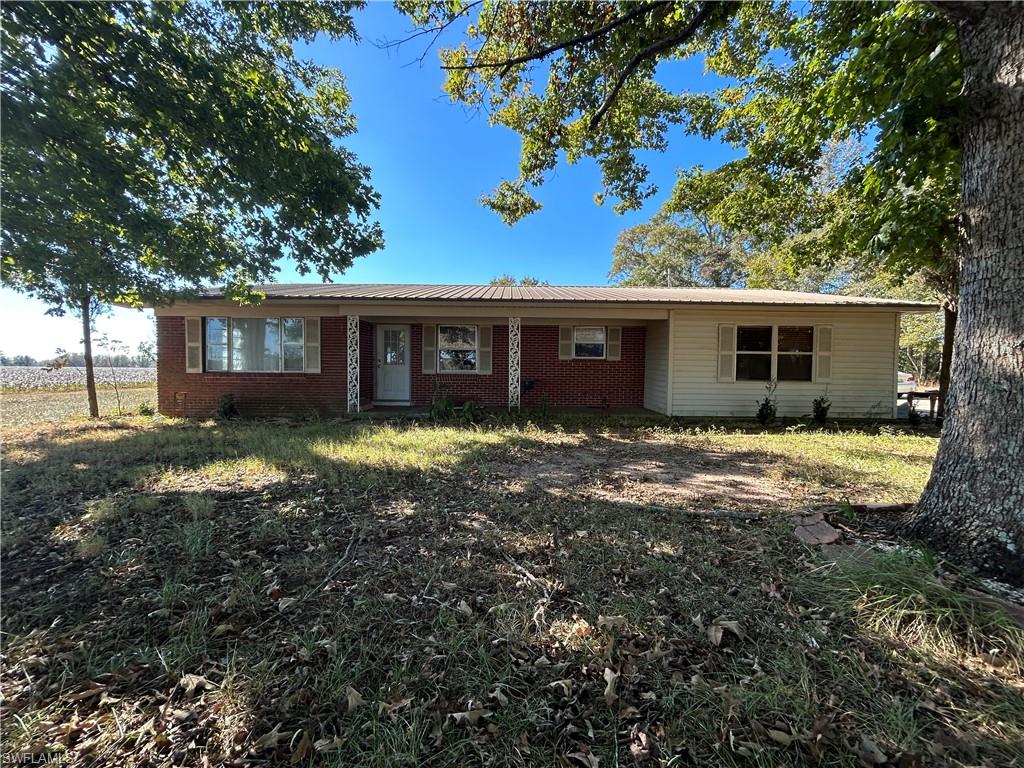 Investors special! Brick home with metal roof situated on 1.81 acre lot with a massive Pole barn on a concrete slab. This home is an excellent opportunity for a Fix and Flip or for someone wanted to privacy and a blank slate. This home needs a good amount of TLC but is priced accordingly. All items in this listing should be verified by the buyer.