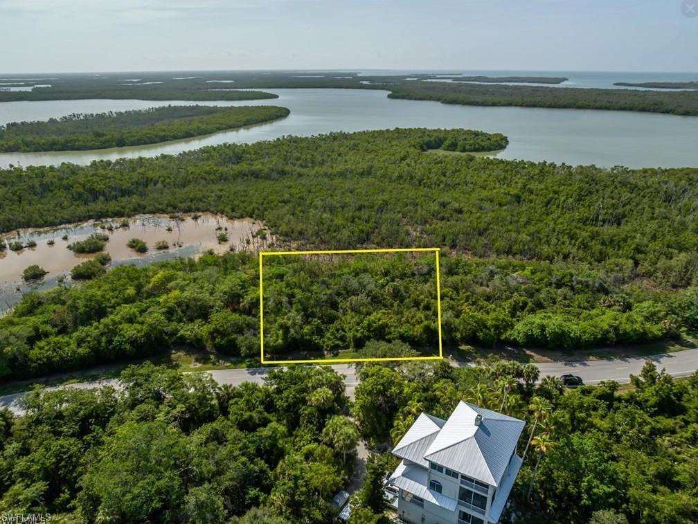 Steeped in rich history and timeless allure, this extraordinary private island was once home to the ancient Calusa Indians and later the flourishing pineapple plantation of Captain Horr. Today, this exclusive 543-acre gated enclave, featuring nearly 135 homesites, is emerging as one of Southwest Florida’s most coveted destinations for luxury waterfront estates. This exceptional vacant homesite offers the perfect canvas for a magnificent custom residence, where each morning begins with breathtaking sunrises and the tranquility of island living. Residents enjoy a lifestyle defined by natural beauty and refined amenities, including scenic walking and biking paths, winding paved roads, boat slips, marina parking, a community clubhouse, and tennis courts—all within a pet-friendly setting. Ideally located just moments from beaches, dining, boutique shopping, and the esteemed Marco Island Academy, this is a rare opportunity to create a legacy property in a setting unlike any other.