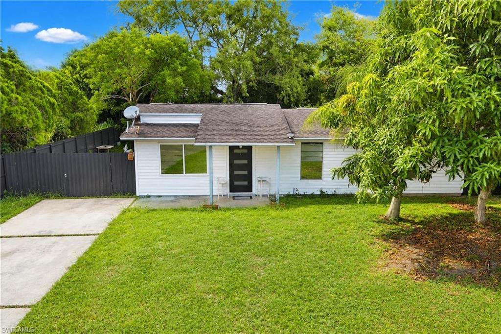 Prime investment opportunity in desirable central Lehigh Acres! This oversized, recently fenced property features city water and sewer—perfect for investors or first-time buyers seeking strong ROI or an affordable dream home. 3 bedrooms, 1.5 bathrooms with fresh vinyl flooring throughout and new kitchen appliances. Primary bedroom includes private bath and walk-in closet. Open-concept kitchen, dining, and living space with great flow, plus convenient hallway laundry. Spacious covered patio with slider access—your private oasis for entertaining. Oversized yard with mature landscaping offers endless possibilities for storage, workshop, or gardens. Quiet side street just off Alabama Ave and Palm Blvd, close to churches, dining, shopping, schools, and services. Unbeatable value—schedule your showing today!