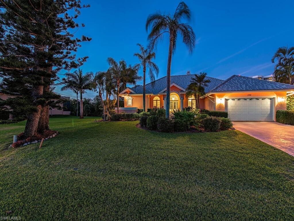 H1334 - Custom Gulf access home sitting on 2 lots (160 x 120!) May inquire about splitting into 2 lots! Elevated and open 3 bedroom plus office/den! Super spacious living room with adjacent dining room plus a separate huge family room leading out to the generous screened lanai and pool area. Expansive pool deck perfect to entertain and enjoy the ambiance of the pristine mangroves. Out back the fun begins with a huge patio and boat dock. Not a house in sight just pristine water views and enjoy the nightly sunset skyline! Open kitchen with island, pass through and fantastic mitered window! Just over 2400 sq. ft. of interior living has 10 ft ceilings throughout with 8 ft solid doors. Private oversized master suite with an additional sitting area and walk-in closets. Wake up to mesmerizing views. New gray roof and manual hurricane shutters included. Surrounded by newer homes. The sought after Flamingo Avenue boasts the shortest amount of “no wake” to get out in the Gulf and to walk to beach! Bike to sugar sand beaches, Mercato, tennis, The Ritz and a plethora of fine dining and shopping are all at your fingertips. Boating at its best from your own back yard!