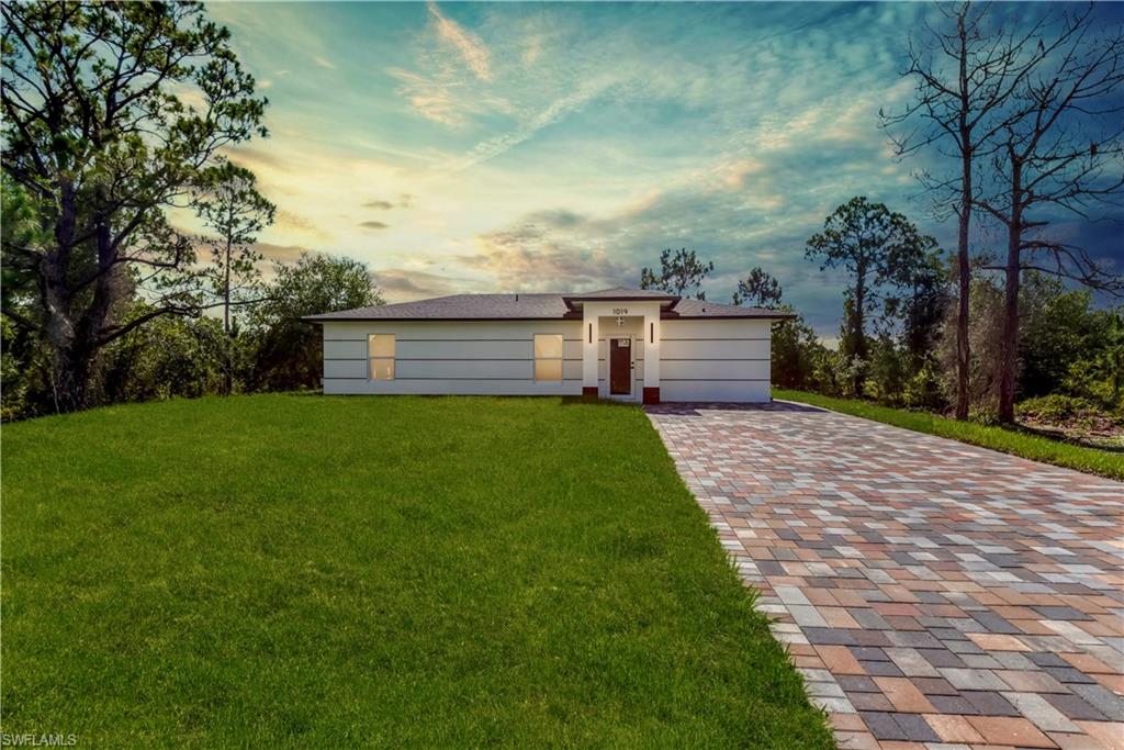 Welcome to this move-in ready MAGNIFICENT (2026) 3/2 home nestled away just minutes from state rd 82 & a quick commute to Fort Myers. This split floor plan spotlights enticing oversized porcelain tile, admirable QUARTZ countertops, soft-close SHAKER cabinets, an attractive accent Breakfast bar, STAINLESS STEEL appliances, and flattering fixtures. This modern design also highlights IMPACT windows and doors, a preserving TANKLESS water heater, recessed lighting, an impressive TILED shower with a built-in niche and rainfall shower head, upgraded hardware, a desirable WALK-IN closet, laundry under air, custom mirrors, HIGH SPEED internet, an irrigation system, and an awarding back patio with pavers that is great for entertaining! Just minutes from all major amenities, Schedule your showing today!