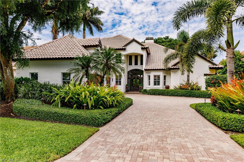 Rare opportunity to own this Elegant 2 story Estate Home, which is surrounded by mature landscaping and views of  Lake & 3rd hole of Bay course at Pelican Bay club. The minute you enter you are captivated with the attention to detail throughout the home. Spacious downstairs includes family, great room, den, dining, kitchen and Master bedroom suite. Master has beautifully detailed tray ceiling & French doors leading out to the expansive lanai.  MB closets masterfully planned for organization including a pull out slider for your shoes. 
The kitchen is light, bright and welcoming with it's brand new sub-zero refrigerator/freezer and gas stove.
Upstairs includes 3 en-suite bedrooms plus office area 
Entertain family & friends in heated pool a nd spa. Separate pool bath has a shower, pull out drawers and Aqualine controls for pool/spa.  too many built in's, upgrades & storage spaces to list
"Pelican Bay sets the bar when it comes to luxury living with exclusive amenities including private beachfront restaurants, beach services, tennis courts and pro shops, full service fitness center, community center, canoes and kayaks, sailing, wellness studio and nutrition and health services.”