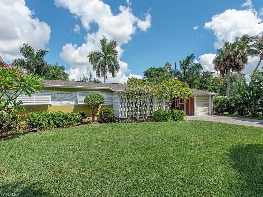 H.15086 - Three Bedroom two bath waterfront in Brookside neighborhood with Gulf access.New tile, cabinets, stainless kitchen appliances, doors, bathrooms, paint and roof in 2018.New a/c system in 2017. The private boat slip in backyard gives you access to the Gulf of Mexico. Plenty of room for a pool. The large screened lanai overlooks the backyard and canal. Complete with a carport, garage and workshop on a quiet street with no thru traffic. Walk to Oakes Farms and only minutes from 5th Avenue and the beaches.