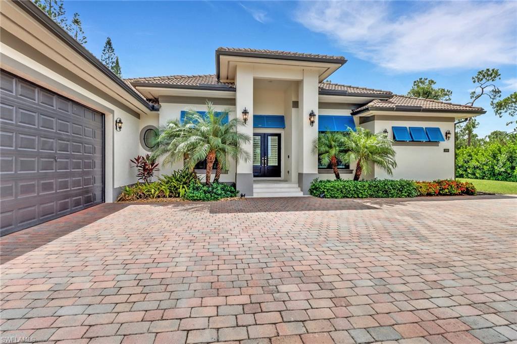 This custom luxury estate home sits on approx. 2.37 acres and includes over 3,500 sq ft.in the heart of Naples. The main living space is very open and features 13" ceilings along w/ 4 bedrooms, 4.5 bathrooms. The gourmet kitchen has spacious custom cabinets, separate pantry area, s.s. appliances, and 2 large islands. The spacious dining room and living room both having glass patio doors that open up to the custom pool area. Each bedroom has en-suite full bath and the master suite features his & her closets, dual vanities, and a frameless glass walk in shower w/his and her showerheads &  sep. tub. This home was built with longevity in mind as the construction has Impact Window & Doors, home is fully insulated, & there is a code for gated entry to the private lot. Additional features include Plantation shudders, a lighting system that connects to smartphones, 3 garages with 12' heights and 10' doors along w/custom finish flooring. The pool comes with bubblers, spa, sun shelf, and even an outdoor kitchen w/lots of space to relax and enjoy your private preserve view. Location: only a short distance from the action, minutes away from malls, shopping, golf, beach is a short ride away.