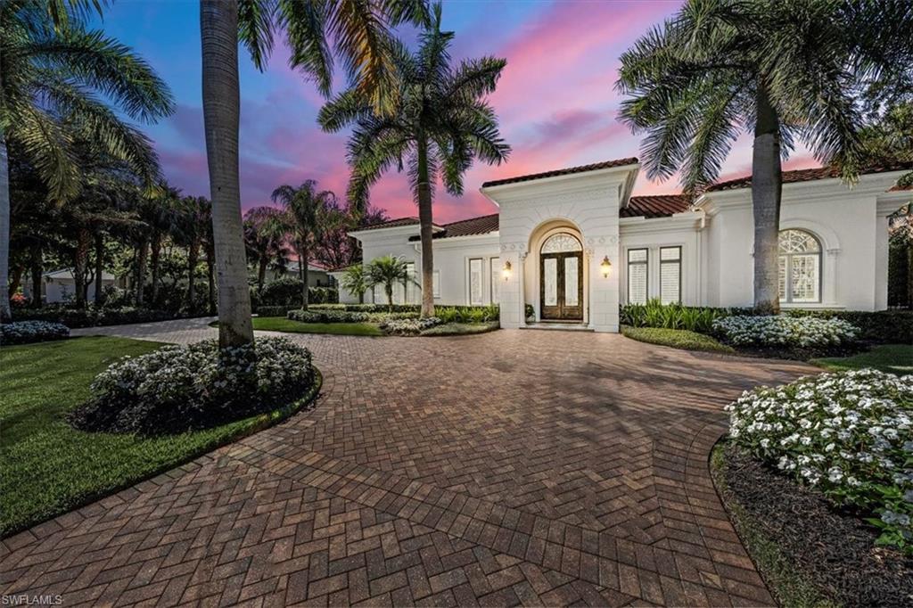 Offering sweeping views of the 13th fairway of the Lakes course in Quail West  this Landmark Construction home boasts over 4,241 square feet of living space for today’s active lifestyle.  A new bedroom suite was added in 2020 for a total of 4 bedrooms/4 full and 1-1/2 baths plus den.  The vaulted foyer opens to a gracious living room with fireplace and window wall overlooking pool & fountains. The dining room adjoins wet bar and wine storage. The chef’s kitchen stainless appliances includes gas cook-top, 2 dishwashers, granite counters, island & breakfast bar. The primary suite opens to private fully caged lanai with picture frame screens, large sitting area, custom wardrobes, luxurious marble bath & spa tub. The family room invites an indoor/outdoor lifestyle with pocket doors opening to a grand loggia, summer kitchen, Firepit pool and spa. Additional amenities include a fenced backyard with open green space for pets, children or entertainment, impact windows/doors, and whole house generator.  2 propane tanks 1-  500 gallon  and 1- 1000 gallon.  Newer roof (2019).  Social membership is transferable.  Don’t miss this beautiful home located in the premier community at Quail West.