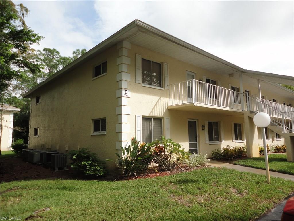 Desirable 2/2 second floor end unit with a gorgeous view of a wooded area.  New countertops in kitchen and bathrooms.  Large laundry room with newer washer and dryer.  A/C was replaced.  Newer carpet.  Vaulted ceilings add to the spaciousness of the condo.   Low quarterly fees.  Community pool with clubhouse, barbeque grills, and two tennis courts.    Short drive to Fifth Ave. and the beach.