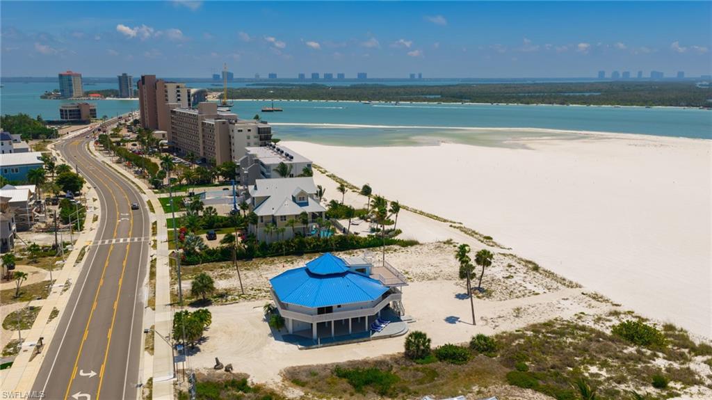 One or more photo(s) has been virtually staged, AI generated or rendered.  Engineered for resilience and designed to stand apart, this distinctive octagon-shaped, elevated beachfront residence on the coveted south end of Fort Myers Beach offers a rare combination of architectural strength and coastal elegance. Its unique structural design enhances durability against coastal elements while maximizing panoramic Gulf views—creating both peace of mind and a truly one-of-a-kind living experience.
A truly unique gem, the home features 3 bedrooms, 2.5 baths, plus a spacious loft with a bunk bed to accommodate additional guests. Currently operating as a successful income-generating property, it presents immediate appeal for investors seeking strong rental performance in one of Southwest Florida’s most desirable beachfront markets.
Positioned on an expansive 85-foot-wide beachfront lot, the property offers exceptional scale and direct, unobstructed access to the Gulf, with the sand and shoreline just steps from your door. The elevated construction and proven resilience further enhance long-term value, while sweeping water views and unforgettable sunsets define the lifestyle.
Ideally located, the south end provides a quieter, more residential setting while still offering convenient access to Naples, Bonita Springs, and Southwest Florida International Airport. Nearby shopping, dining, and entertainment options add to the appeal for both personal enjoyment and vacation rental guests.
Whether you’re expanding your portfolio or securing a distinctive beachfront retreat with immediate income potential, this property delivers on every level—design, durability, location, and lifestyle.