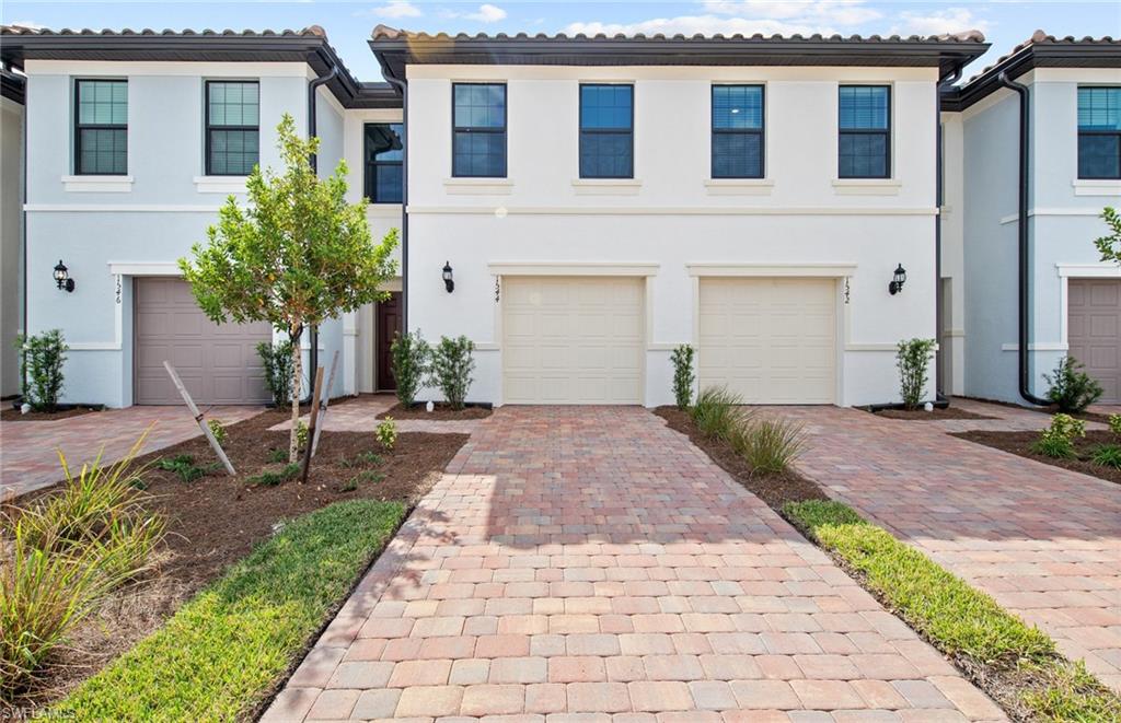 The Alder is a beautiful brand new 3 bed, 2.5 bath, 1 and a half car garage townhome by Centex in the established highly desired Coral Lakes Community. This home boast Quartz countertops and white cabinetry throughout the home. 18x18 ceramic tile downstairs and the wet areas upstairs. This split bedroom floor plan offers spacious bedrooms with walk-in closets, tiled showers and a dual sink vanity in the owner's suite. Stainless Steel Whirlpool kitchen appliances plus washer & dryer. This home comes equipped with a covered Lanai overlooking your lake view, water display and beautiful Florida skies! Steps away from pool #1 makes it convenient for some R&R There is an additional pool, volleyball, fitness center, playground, tennis and more! Hurry up, you don't want to miss this opportunity!