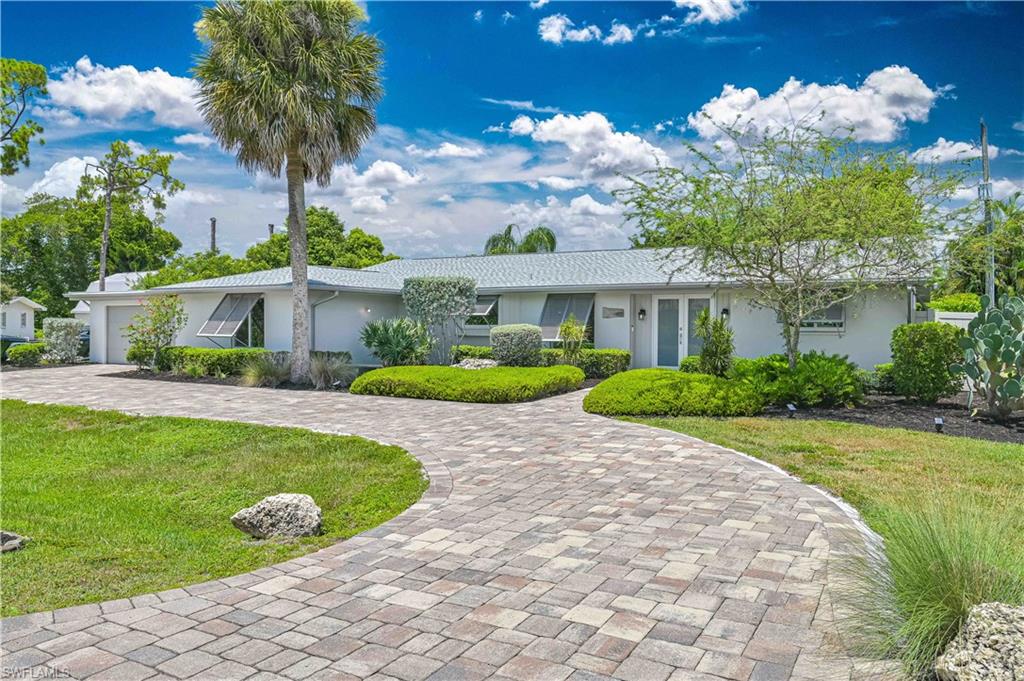 Beautifully renovated 4-bedroom, 3-full bath pool/spa home in the highly desirable Fort Myers Villas with no HOA, no deed restrictions, and located in Flood Zone X. This light-filled, open-concept home features a stunning kitchen with a large island, quartz countertops, soft-close cabinetry, designer tile backsplash, and stainless-steel appliances. This property includes fully remodeled bathrooms, luxury plank tile flooring throughout, LED lighting, and a beautiful shiplap accent wall in the great room. The spacious owner's suite features a custom wood plank ceiling for added warmth and character. 
Pocket sliders open to your private outdoor oasis featuring an oversized screened lanai, heated pool, therapeutic Caldera spa, and a child safety fence for added peace of mind. The fully fenced backyard offers privacy and plenty of room to relax or entertain. 
Major upgrades include a new roof (2023), blown-in attic insulation (2023), and a new washer & dryer (2025). The home is equipped with hurricane-impact windows and doors, plus manual pull-down hurricane shutters for the lanai sliders, providing exceptional storm protection. 
The attractive paver circular driveway is complemented by drought-tolerant landscaping, while the hidden side driveway offers ample space for work vehicles, an RV, boat, or trailer. Centrally located just minutes from shopping, dining, parks, Downtown Fort Myers River District, SWFL beaches, and the RSW International Airport, this move-in-ready home truly offers the best of Southwest Florida living!