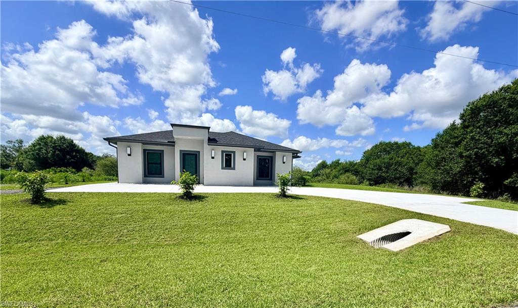 Welcome to your little country home.

If you’ve been dreaming of peace, privacy, and a cozy modern home with plenty of outdoor space, this beautiful property in LaBelle, Florida, might be exactly what you’ve been looking for.

This charming home offers the perfect combination of comfort, functionality, and peaceful country living. It features three bedrooms, two bathrooms, a modern kitchen with a beautiful quartz island, stainless steel appliances, impact windows, and a cozy lanai perfect for relaxing after a long day.

The home also includes a walkway surrounding the entire property, an automatic sprinkler system, and a spacious main driveway with room for three to four vehicles. In addition, there is a separate milling driveway ideal for heavy equipment, trailers, RVs, boats, or work trucks.

Situated on 1.25 acres, this property gives you plenty of outdoor space to enjoy. There’s plenty of room behind the home to park equipment, trailers, or simply enjoy the privacy, peace, and quiet surroundings this area of LaBelle has to offer.

The little country home you’ve always dreamed of is waiting for you.