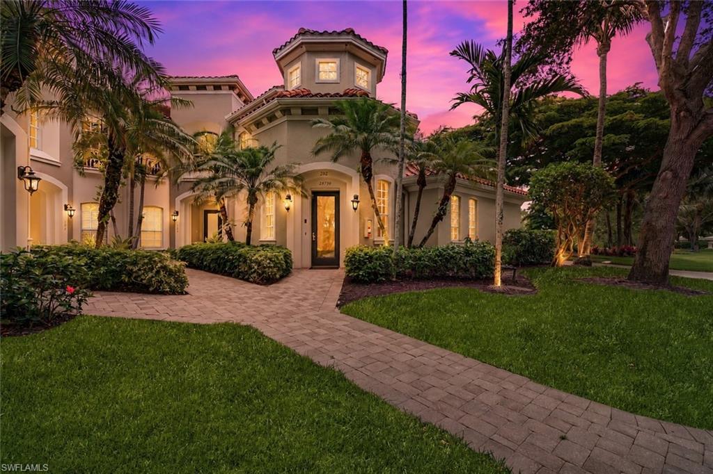 Former Builder's Model located in Vasari's premier bundled golf community, where golf membership is included with ownership! Arguably one of the most spectacular views in Vasari Country Club! Impeccably maintained and reflecting true pride of ownership, this exceptional end-unit coach home is offered turnkey furnished with immediate occupancy available. Perfectly positioned with no neighboring building to the north, enjoy breathtaking panoramic lake and golf course views overlooking the #6 green and spectacular sunrises.

The private entrance welcomes you into a grand foyer with soaring ceilings, exquisite architectural details, a stunning custom staircase, and designer finishes throughout. Throughout the home you'll discover upgraded crown molding and baseboards, recessed lighting, decorative tile inlays with custom wrought iron accents, plantation shutters, and surround sound.

The spacious open floor plan is ideal for entertaining and everyday living. The kitchen features 42-inch cabinetry with crown molding, under-cabinet lighting, a center prep island, walk-in pantry, and a sunny breakfast nook overlooking the lake and golf course. The expansive living room flows seamlessly to the screened lanai.

The private den showcases rich wood flooring, custom built-in cabinetry, plantation shutters, and pocket doors, creating the perfect office, media room, or additional guest sleeping area.

The split-bedroom layout offers privacy for all. Two generous guest bedrooms each feature walk-in closets and share a convenient Jack-and-Jill bath. The spacious primary suite is a true retreat with private lanai access, custom ceiling details, two walk-in closets, and a luxurious bath with dual vanities, linen cabinet, soaking tub, and separate walk-in shower.

Additional highlights include a powder room, laundry room with utility sink and abundant storage, plus an oversized two-car garage with epoxy flooring custom storage shelving.

Major updates provide exceptional peace of mind, including TWO brand-new A/C systems (2026), a 2024 hot water heater, new garage door (2025)a water softener, whole-home dehumidifier, newer community roofs, and recently painted exteriors.

Located in Vasari's premier bundled golf community, golf membership is included with ownership. Residents enjoy championship golf, an aqua driving range, putting greens, tennis, bocce, a resort-style pool and spa, clubhouse dining, and an active social calendar. New pickleball courts are nearing completion and will soon add to the exceptional amenity package. Beyond the outstanding amenities, Vasari is known for its welcoming membership, friendly staff, and vibrant social atmosphere that make it easy to feel at home. Conveniently located near Gulf beaches, shopping, dining, entertainment, and Southwest Florida's airports. Move right in and start enjoying the Southwest Florida lifestyle.  Note- 3D tour link provided and floor plan in photos carousel.