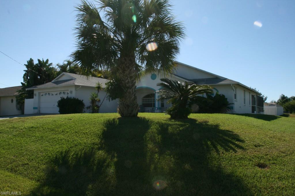 Beautiful, well maintained spacious home in SW Cape Coral. This home is perfect for a family or out of state buyer looking for a turnkey house with pool in a great neighborhood.  Tons of Florida sunshine throughout this home, it's light, bright and cheery and located in a neighborhood of newer homes.  On a corner lot with plenty of yard and outdoor space. Nice kitchen with beautiful wood cabinets includes bar counter and stools which opens up to lovely dining area which overlooks the pool/jacuzzi and lanai area.  Large great room perfect for watching TV and entertaining.  Living room sliders open to large outdoor covered patio/lanai which is great for grilling and relaxing by the pool.  Private and spacious master bedroom with walk in closets and full bath also overlooks the pool area.  Three additional spacious and private bedrooms with a full bath are located on other side of the home.  Large laundry room and two-car garage.  This home looks brand new inside and out.  Convenient location for schools, shopping, dining, beaches, boat ramps and more!