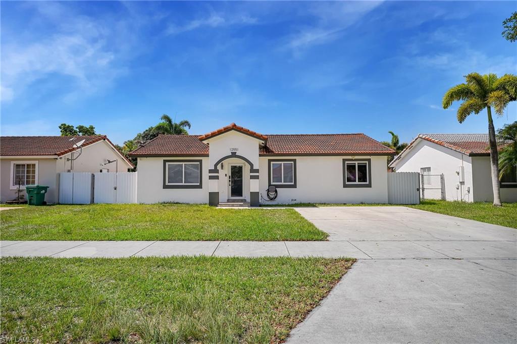 Charming 3-bedroom, 2-bath home offering the perfect blend of comfort, privacy, and versatility. This beautifully remodeled property features tile flooring throughout the main living areas, creating a modern and move-in-ready feel. The updated kitchen includes brand-new appliances, hurricane-impact windows and doors, and window blinds throughout. The home is also equipped with a security camera system for added peace of mind.Step outside to enjoy a spacious backyard with a fenced patio, ideal for entertaining, relaxing, or pets. A standout feature is the detached guest suite complete with its own bedroom, bathroom, and kitchenette—perfect for extended family, guests, a home office, or potential rental income.NO HOA and NOT IN A FLOOD ZONE, giving you greater flexibility and long-term savings. Conveniently located in a peaceful setting, this move-in-ready home offers comfort, functionality, and exceptional value.