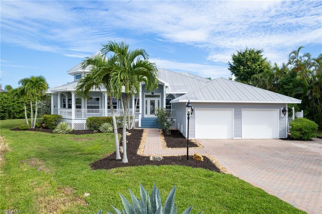 Step into coastal elegance at 18210 Chesapeake Court, a beautifully remodeled home nestled within the exclusive, gated community of Tidewater Island in Fort Myers. This spacious 3-bedroom plus den, 2.5-bath residence sits on an oversized lot and has been thoughtfully updated to blend charm, comfort, and modern convenience. From the welcoming front porch to the soaring volume tray ceilings and crown molding inside, this home offers a warm, inviting atmosphere that feels instantly like home. French doors lead out to a stunning two-tier screened lanai with a private pool, raised spa, and dedicated pool bath, creating the perfect outdoor retreat for entertaining or unwinding in peace. Inside, the kitchen has been completely renovated with stainless steel appliances, a walk-in pantry, and generous counter space ideal for everyday living and gathering with loved ones. The open floor plan flows effortlessly into a bright and airy living room, freshly painted in soft, neutral tones and filled with natural light. The primary suite is a true retreat, complete with a large walk-in closet and a beautifully updated en-suite bathroom featuring modern finishes and a walk-in shower. Two additional bedrooms plus a flexible den space offer endless possibilities for guests, a home office, or playroom. The home has been remodeled throughout in 2024, including a new water heater, new stainless appliances, updated bathrooms, new laminate flooring, and interior paint. A new A/C system was installed in 2022, and a reverse osmosis system adds extra peace of mind. The oversized garage provides ample storage, and the expansive rear yard includes a wood deck and plenty of room to enjoy the outdoors. Located on a quiet cul-de-sac street in a tranquil, non-cookie-cutter neighborhood, this property offers privacy and a sense of place, all just minutes from the beaches, shopping, dining, and the airport. Low HOA fees, no CDD. Homes in Tidewater Island rarely come available, and this one is truly special, offering refined upgrades, thoughtful design, and that rare feeling of “HOME” the moment you walk through the door.