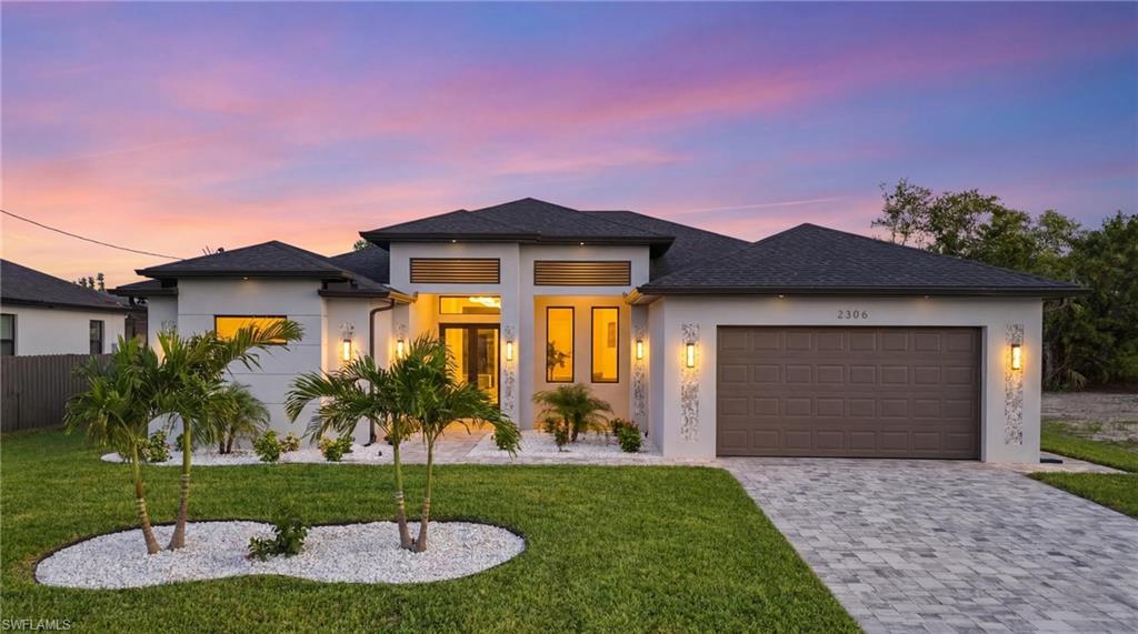 Introducing a SPECTACULAR WATERFRONT New Construction Home in SW Cape Coral, FL! This home perfectly blends modern elegance with everyday functionality. This thoughtfully designed residence features 3 spacious bedrooms plus a dedicated office, 3 full bathrooms, and a generous 2-car garage—ideal for comfortable living and entertaining at 2131 sq. ft. of living space.

Situated on a highly elevated homesite in a prime location close to Surfside Blvd (No Flood Zone), this home offers both peace of mind and convenience. Inside, you’ll find a sleek, contemporary design with beautiful finishes throughout with porcelain tile throughout the entire house, 12 ft coffered ceilings in the living room and natural sunlight through the large windows and sliding doors. 

The living room features a custom tile tv enclosure that comes with an 85” TV, and an electric fireplace. The kitchen is a true centerpiece, showcasing beautifully designed cabinetry with plenty of storage space, a gorgeous oversized quartz island, and stainless appliances—perfect for cooking and gathering.

The large & luxurious primary suite offers a private retreat with sliding glass doors that provide direct access to the screened-in lanai. The primary bathroom is designed for relaxation, featuring a walk-through shower and dual shower heads, a soaking tub for a spa-like experience with a beautiful fully tiled accent wall, dual vanities, two large walk-in closets with built-in shelving and a private toilet space. 

One of the guest rooms has its own full size private bathroom, while the other guest room has access to the full-size pool bathroom. Built with durability and safety in mind, the home includes hurricane-impact windows and doors. The garage features epoxy floors, while the paved driveway adds to the home’s impressive curb appeal along with the beautiful landscaping. 

Step outside to your private backyard oasis, complete with a luxurious sparkling pool, a fully equipped outdoor grill station, and a screened-in lanai extending the entire length of the back of the house—creating the perfect space for relaxing or entertaining year-round while overlooking the 80ft wide freshwater-canal in your backyard. Enjoy the year-around sunshine with Southern exposure and don’t forget to use that fishing pool every once in a while!

This exceptional and thoughtfully designed home needs to be seen in person to truly appreciate every detail! The property offers the perfect combination of style, comfort, and Florida living at its finest. Schedule a tour today!