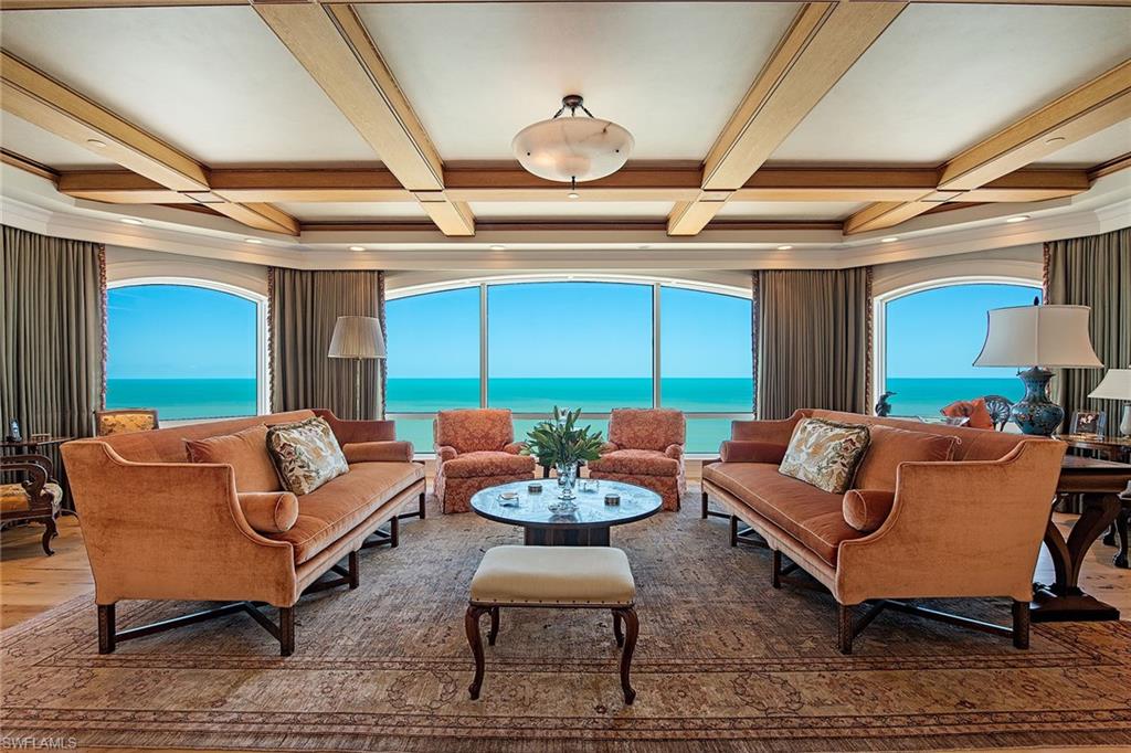 Step off your private elevator into this stunningly remastered beachfront penthouse with endless views of the Gulf located in the prestigious Windsor at Bay Colony. Encompassing over 8,550 square feet designed to meet the discerning taste of quality living and elegance while spanning the entire 19th floor. Features include the finest of warm chestnut flooring, custom cabinetry and millwork, an elegant wine room, spacious grand salon and custom bar area, office and library, media theater, magnificent chef's kitchen with state-of-the-art appliances including Wolf gas cooktop and Sub-Zero refrigeration, spacious two-room butler's pantry, smart home fully integrated Savant system and motorized Mecho shades. The primary suite is a masterpiece of luxury with dual baths, steam shower, custom closets, fitness room and office. Car enthusiasts will appreciate the three-car air-conditioned garage and an ideally positioned cabana leading to the pool terrace. The Windsor offers unmatched amenities with a redesigned 24-hour front desk, boardroom, social room, fitness, massage room, three guest suites, pool and spa. Bay Colony residents enjoy membership at the beach club and tennis center.