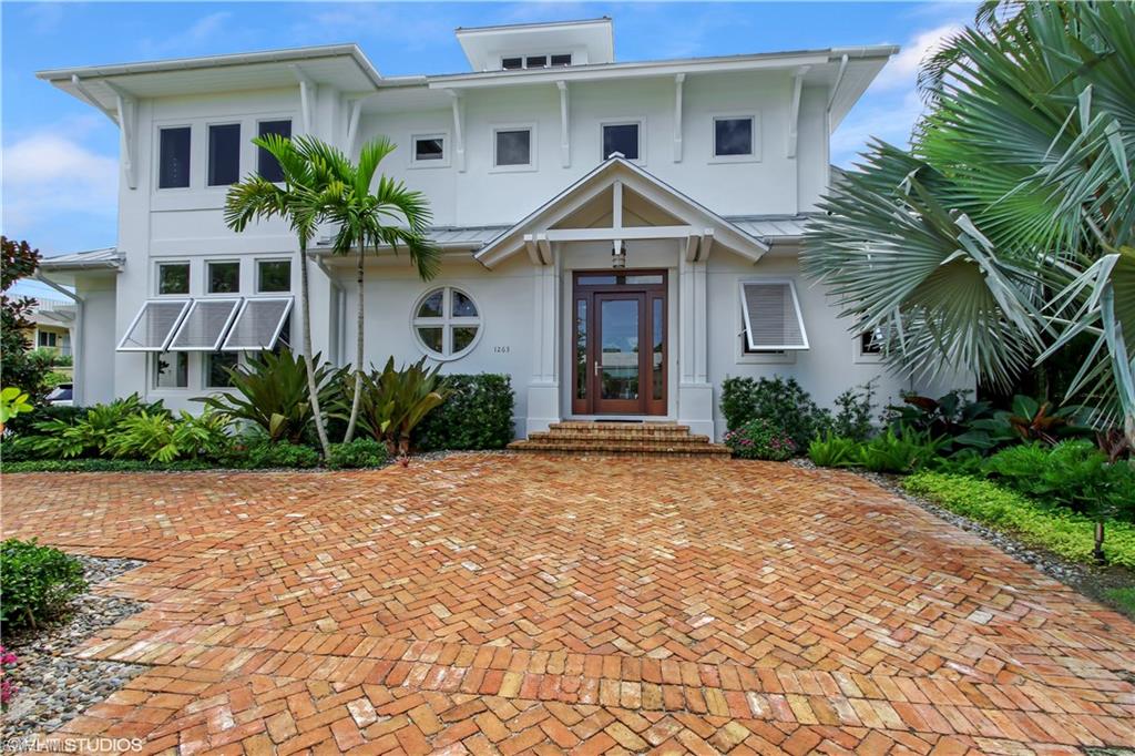 Nestled in the heart of the vibrant downtown Olde Naples area is this stunning new construction home. Just a few short blocks to the beach and one block to 3rd Street's famous shopping and dining. A stunning example of MHK's extraordinary architecture and state of the art design, this home includes five bedroom suites with a first floor master and offers the ultimate Florida lifestyle. Exquisite interior finishes abound, complimented with designer lighting and white oak wide plank flooring. The gourmet kitchen and family room are truly exceptional where natural light floods through dramatic folding glass walls. Open and expand your living space to include a pool/spa, outdoor kitchen and fireplace. Come experience high style luxurious living at its best while still preserving the warmth and charm of Olde Florida. Truly a masterpiece, this most magical home is being offered completely furnished and is turn key ready.