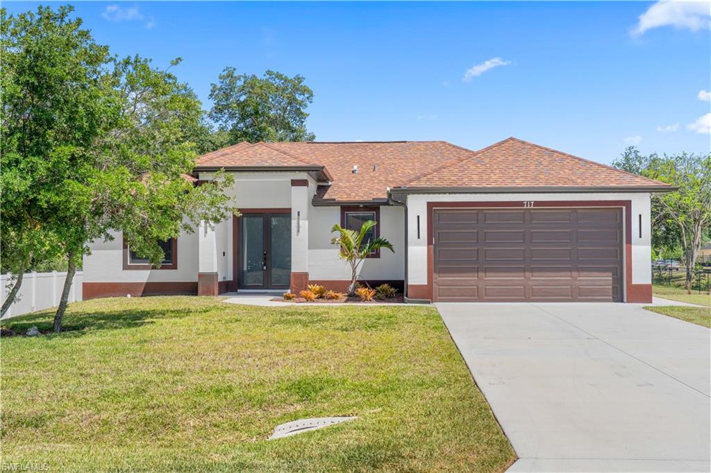 Whether you're buying your first home, relocating to Southwest Florida, or simply looking for a brand-new home with modern finishes and extra outdoor space, this property checks all the boxes. new construction,  3-bedroom, 2-bath home offers 1,536 square feet of thoughtfully designed living space on an oversized CORNER  lot with plenty of room for a pool, RV, boat, or future outdoor entertaining.
The open-concept layout features quartz countertops, impact windows and doors, tile flooring throughout, tray ceilings, and quality finishes that make the home feel both stylish and functional. The spacious two-car garage with epoxy flooring adds durability and extra storage.
Located in one of Lehigh Acres' fastest-growing areas, you'll enjoy convenient access to SR-82, making the commute to Fort Myers, RSW International Airport, shopping, dining, and healthcare simple. With no HOA and the peace of mind of owning a new construction home, this is an excellent opportunity for anyone looking for low-maintenance Florida living.

(images are from sister home)