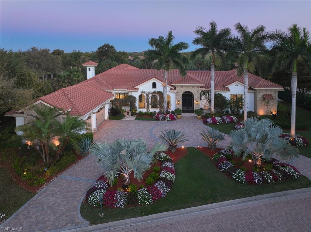 This is a unique opportunity to obtain an immediate Colony golf membership! Among the rarest offerings to emerge in Tuscany Isle within The Colony, this landmark single-family estate commands over 5,300 square feet of living space set upon more than three-quarters of an acre of immaculately curated landscaping. It offers a scale of privacy, proportion, and presence that defines true estate living in Southwest Florida's most prestigious golf community. This is not a home you simply live in; this is a home you retreat to.
The outdoor living experience elevates this property to an entirely different category. Guest suites with their own private ensuite bathrooms, flank an expansive resort-style pool and entertaining terrace that captures the Florida sun at its most generous. The layout was conceived specifically for true outdoor entertaining at scale. An outdoor fire pit, a cozy fireplace with multiple covered living and dining areas, and lush professional landscaping complete a compound that functions as a private resort: beautiful, autonomous, and fully self-contained.
Inside, Old Florida warmth and unparalleled craftsmanship meet without pretension. Exquisite millwork ceilings frame every room, highlighting warm and inviting interiors and a sensibility that is refined and genuinely livable, never ostentatious, always exceptional. The great room flows openly and generously, drawing family and guests naturally together while maintaining the unhurried ease that defines this home. A wine bar anchors the entertaining space, while professional Wolf appliances define an expansive, yet welcoming kitchen designed for both casual mornings and effortless holiday gatherings.
The primary suite is exactly that: an oasis. Conceived as a private sanctuary within the estate, it offers the serenity and spa-caliber finish befitting a true retreat, with every detail considered and nothing overlooked.
This is a true family compound, the rare property where three generations can gather under one roof, where guests arrive for a long weekend and stay for the week, and where every family unit feels equally at home. A spacious 3-car garage and a whole-house generator ensure seamless, uninterrupted enjoyment whether you are in residence or away. These details speak to the broader character of this home: nothing left to chance, nothing left to want.
For the luxury buyer seeking an estate of genuine distinction, where guests experience the privacy of their own retreat while remaining warmly connected to the whole. Some estates are admired. This one is felt.