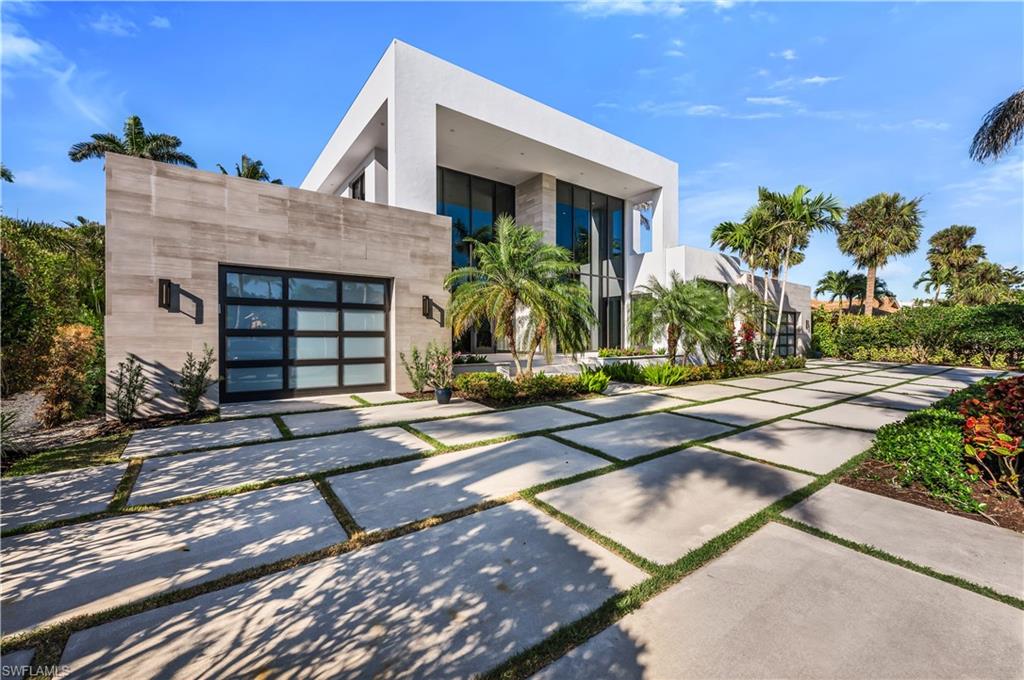 Welcome to 665 Fountainhead Way, a modern tropical masterpiece created by Joel Barnes Homes. Built in 2016 to the highest specifications, with exceptional high end finishes. Soaring ceilings with walls of windows offers spectacular open living with a true connection to the natural outdoor setting. Chef's kitchen featuring German ALNO cabinets, new quartzite countertops, Thermador duel ovens, Sub Zero Refrigerator, dual dishwasher, induction cooktop, wine cooler and built in coffee/espresso system. The ground floor main bedroom has pool side access to the spa, two walk in closets and incredible spa bathroom with separate tub and walk in shower. A second ensuite first floor bedroom offers plenty of first floor living. Dual sided main living room fireplace offers opportunities for elegant and casual living. Second floor living offers three bedrooms with two ensuite bathrooms and full deck access from all bedrooms. The backyard is a tropical oasis with newly installed putting green, full outdoor kitchen. Beautiful sparkling pool with infinity edge and sun shelf. Climate controlled 3 car garage with whole home generator. A remarkable home inside and out!