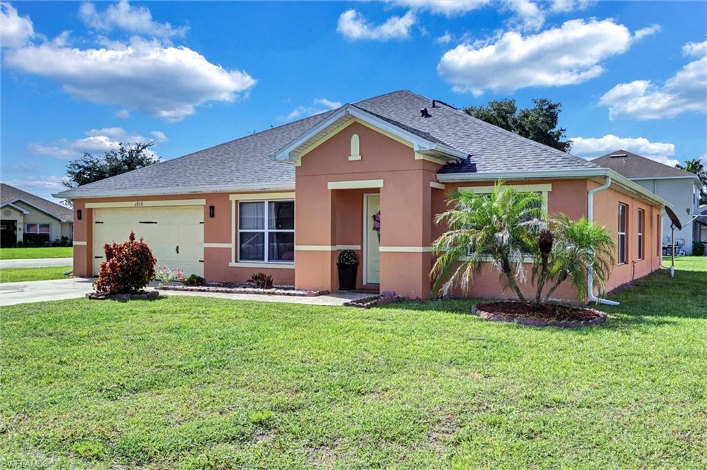 Located in the heart of the Town Lakes Community in Lehigh Acres, Florida, this stunning corner lot features 3-bedroom home features a den converted to a bedroom, which can also serve as a flexible space. This gives you a total of 4 bedrooms in the 2,299 sq ft of open-concept living on a spacious 0.26-acre corner lot. Enjoy tile flooring throughout, a partial canal view from the rear, and plenty of natural light pouring in through lots of windows beneath high cathedral ceilings. The beautifully remodeled kitchen features a breakfast bar, lots of great cabinet space, pantry, and stainless steel appliances. The is roof (2025), also boasts a Jack-and-Jill bathroom, a large owner's suite with walk-in closet. Located near Lee Blvd, restaurants, and the Fort Myers international airport, Lehigh Acres park is just 1.5 miles away, offering tennis, pickleball courts, walking trails, fitness stations, and picnic areas.