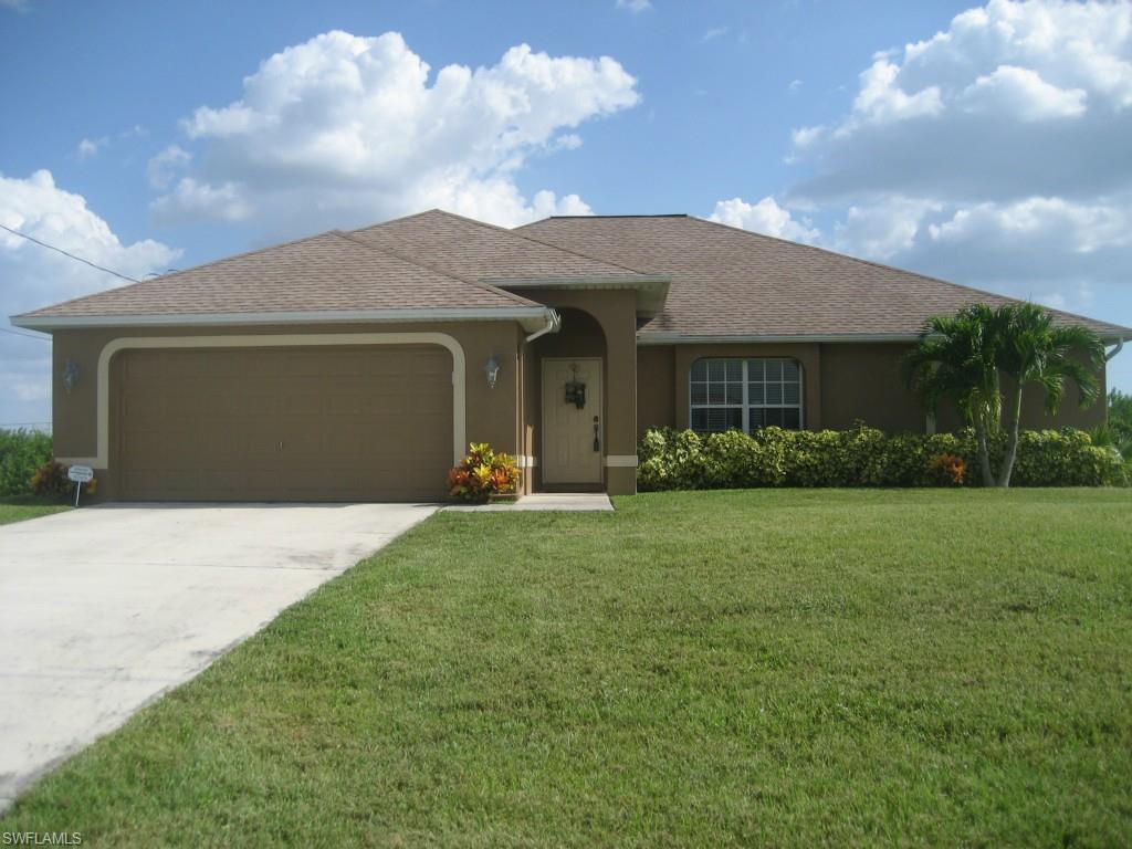Beautifully kept WATERFRONT high ceiling, great room home, sold with the furniture.  Plant shelves in Great room.  Freshly painted, inside and out, all appliances stay.  Alarm system. Seawall in place at freshwater canal, sprinkler system, and under cover lanai. Lovely views of nature out the SOUTHERN exposure back under cover, screened, lanai.  Water system recently updated.  Master bedroom has two walk in closets and a slider to the lanai. Main bath goes out to the lanai.  Inside laundry.