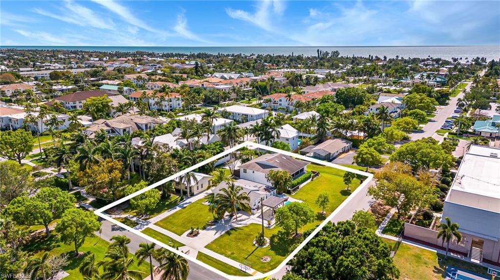 Exceptional Land Value Redevelopment Opportunity in the Heart of Downtown Olde Naples, South of Fifth Avenue South. Situated on a LARGE sub-dividable corner parcel, adjacent to an expansive green space, this rare offering combines immediate enjoyment with outstanding future potential.

The property features a well-maintained high-and-dry concrete block duplex-style residence, offering 4 bedrooms and 4 bathrooms, thoughtfully updated with granite and tile throughout. Two additional cottages on the property provide opportunities for renovation, guest accommodations, rental income, or redevelopment. 

Ideally located within walking distance to many of Naples' most sought-after destinations, including the white-sand beaches of the Gulf of Mexico, Fifth Avenue South, Third Street South, Cambier Park, Naples Pier & Tin City. Enjoy pleasant views, a premier Olde Naples location, and the flexibility to create a remarkable estate, luxury residences, or an investment property in one of Naples most desirable neighborhoods.