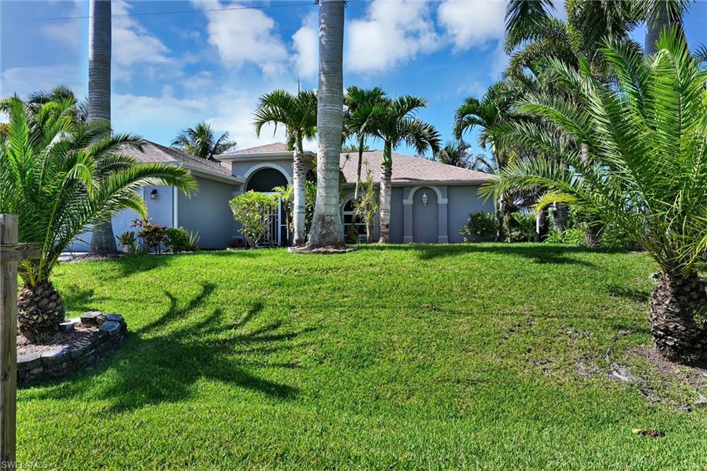 Beautiful 3 bedroom, 2 bathroom home with a pool on a canal. This home offers a perfect blend of comfort, style, and convenience. It is located with easy access to local amenities, shopping, dining, schools, and recreational activities. It is off of El Dorado Blvd N, Tropicana Pkwy N, and Ember Pkwy N. The home features spacious living areas with an open floor plan, providing a welcoming atmosphere for entertaining or relaxing. The well-equipped kitchen boasts modern appliances, ample cabinetry, and a convenient breakfast bar. The large windows throughout the home allow plenty of natural light, highlighting the bright and airy interior into the home. Stepping outside to the backyard to enjoy Florida's beautiful weather on the expansive patio or take a dip in the private pool. The backyard offers a peaceful space to unwind, with plenty of room for outdoor entertaining and gentle breezes off the water. The property also provides access to nearby waterways with a wooden dock that can be used for entertainment, fishing and enjoying the weather.