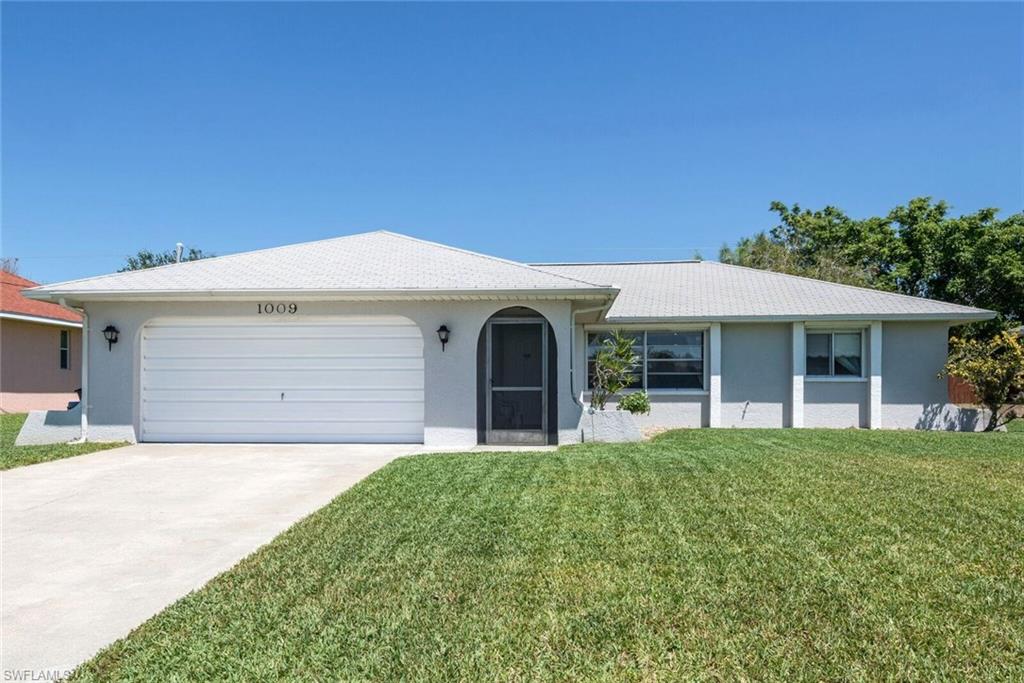 Get this while you can, priced to sell 3 bed 2 bath Pool Home located in sought after SW Cape Coral. House is in move in condition with many new updates: Kitchen just completely remodeled in January of 2016 with all New Cabinets, and Granite Counters, all new tiled floors in main living area and all wet areas, new carpet in bedrooms. new water heater installed 2013, new A/C February of 2014. Pool completely resurfaced, new pool pump, and entire lanai redone with stamped concrete. Electric panel upgraded in July of 2016. Roll down hurricane shutters on all windows. Well manicured lot with nice landscaping. Outside pool area is huge with plenty of room for all your friends and family. Close to schools, shopping, restaurants and all Cape Coral has to offer. Call today for your exclusive showing appointment, this wont last long at this price.