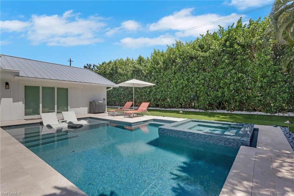 Experience luxury coastal living in one of North Naples' most sought-after neighborhoods. ANNUAL lease Available for end of July occupancy, this impeccably maintained unfurnished 4-bedroom, 3-bath residence offers an exceptional combination of sophisticated design, privacy, and an unbeatable Seagate location.

Nestled on a quiet cul-de-sac west of US-41 on an a high-raised X flood zone lot, this beautifully updated home features a desirable split floor plan, spacious open living areas, designer finishes, a 2-car garage, and a newer metal roof. The stunning chef's kitchen flows seamlessly into the living and dining spaces, creating the perfect setting for everyday living and effortless entertaining.

Step outside to your own private resort-style retreat featuring a spectacular saltwater pool and spa, expansive covered lanai with soaring wood ceilings, lush tropical landscaping, and exceptional privacy. Whether enjoying a quiet morning coffee or hosting friends under the stars, this outdoor space is truly unforgettable.

The location is simply unmatched. Just 1 mile to Seagate Beach and Clam Pass Park, and only 2 minutes to Waterside Shops, Artis-Naples, Mercato, Venetian Village, and Naples' finest dining and shopping. Adjacent to Seagate Elementary School and Seagate Park, the neighborhood offers sidewalks, bike-friendly streets, and a welcoming atmosphere perfect for walking, cycling, and enjoying the Florida lifestyle.

Homes of this caliber and location are rarely available for lease. Small Pet Friendly. If you've been waiting for a residence that combines timeless style, meticulous care, and one of Naples' premier coastal addresses, your search ends here.

Elevate your lifestyle. Live where every day feels like a vacation.