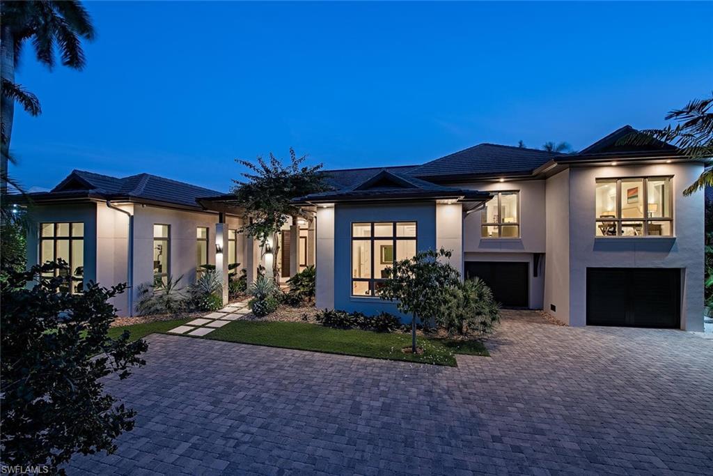 Exceptional custom Knauf Koenig built residence situated on an oversized south facing waterfront lot in Aqualane Shores. Created by Falcon Design this meticulously constructed and carefully thought out 2017 built home includes nearly 5,000 square feet of air conditioned space, 5 bedrooms, 3 car garage, 46’ lap pool/spa, Ipe dockage, two boat lifts (4,500 & 27,000lbs), quick deep water Gulf access, and unrivaled finishes. Some of the features include full concrete construction, natural gas supply, Ruffino cabinetry, generator, mud room, Elan G home automation, sound/security camera systems, 1,000 bottle temperature controlled wine room, Legno Bastone "Tropea" wide plank Oak wood flooring, extensive quartzite and natural stone countertops, Vantage low voltage lighting system, Lutron electric roll down shades, and an additional access to the upper 2 bedroom guest suite with lounge.  The outdoor space offers the ultimate resort lifestyle and includes a large covered outdoor kitchen space with Cypress T&G ceilings, large yard, and fire place complete with automated screen/shutter protection. Positioned in close proximity to Old Naples shops, fine dining, and Naples sugar sand beaches.