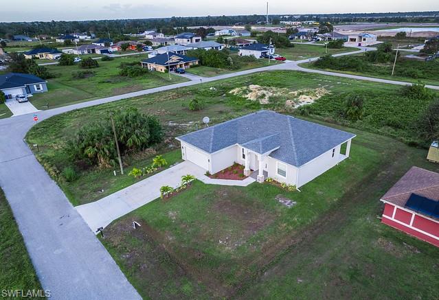 Beautiful 3-bedroom + den, 2-bath home located just minutes from State Road 82 in Lehigh Acres. Offering 1,723 square feet of living space, this well-maintained home features elegant porcelain tile flooring throughout and an open, functional floor plan perfect for families or professionals working from home. The spacious den provides the flexibility for a home office, playroom, or additional living area. Washer and dryer are included for your convenience. For added peace of mind, all windows and the sliding glass door are impact-resistant. The home is also equipped with an ADT security system, activated by the tenant at the tenant's expense. Conveniently located approximately 3 minutes from SR-82, providing easy access to Fort Myers, shopping, dining, schools, and major roadways. Don't miss this opportunity to rent a modern, move-in-ready home in a growing area of Lehigh Acres. Tenant responsible for utilities and ADT monitoring service.