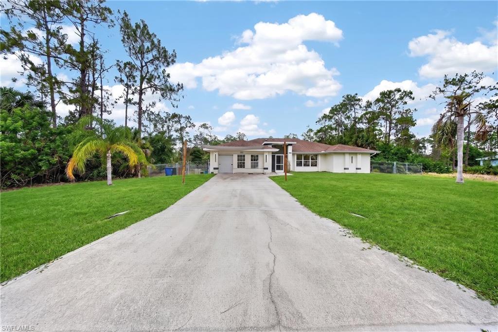 Discover this beautifully updated 5-bedroom, 3-bathroom pool home on a spacious 0.5-acre lot in Lehigh Acres! The property has undergone extensive renovations, including modern updates to the living areas, kitchen, and bathrooms. Additional improvements include a brand new AC system, fresh interior and exterior paint, and an alkaline water filtration system providing clean, healthy drinking water throughout the home. The versatile floor plan offers flexible living spaces, including a converted area from the original two-car garage now functioning as a single-car garage or storage with the other half ideal as a home office or additional bedroom. Two small bedrooms off the dining area, separated by a divider wall, are perfect for overnight guests or a dedicated workspace. The original lanai has been transformed into a comfortable Florida room with direct access to the private pool and outdoor entertaining area. Move-in ready with modern comforts and ample room for family living or entertaining, this home combines recent updates with the charm of Florida outdoor living. Ideal for first-time buyers, growing families, or investors seeking a well-maintained property with strong potential. Schedule your private showing today!